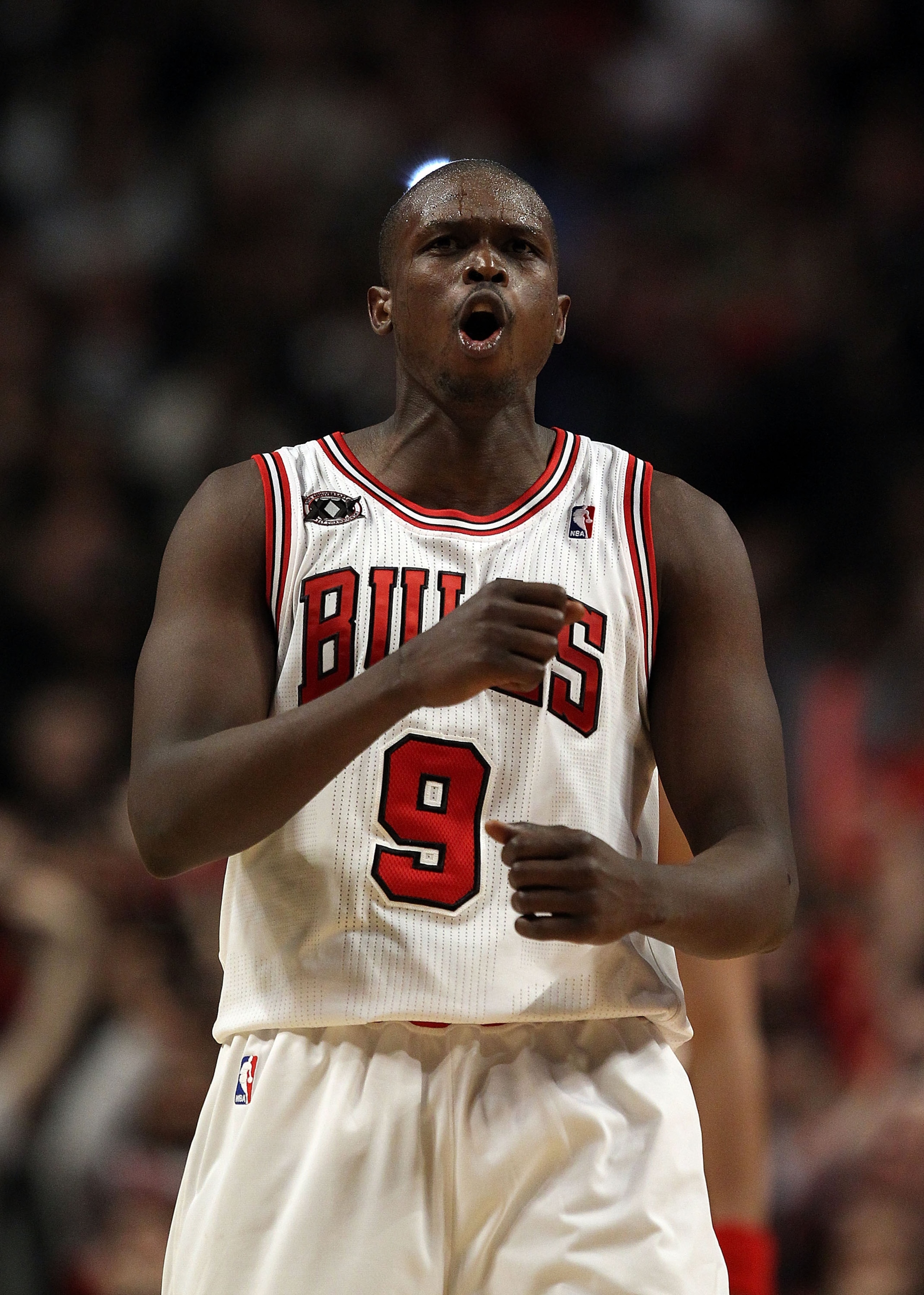 CHICAGO, IL - FEBRUARY 24: Loul Deng #9 of the Chicago Bulls celebrates a win over the Miami Heat at the United Center on February 24, 2011 in Chicago, Illinois. The Bulls defeated the Heat 93-89. NOTE TO USER: User expressly acknowledges and agrees that,