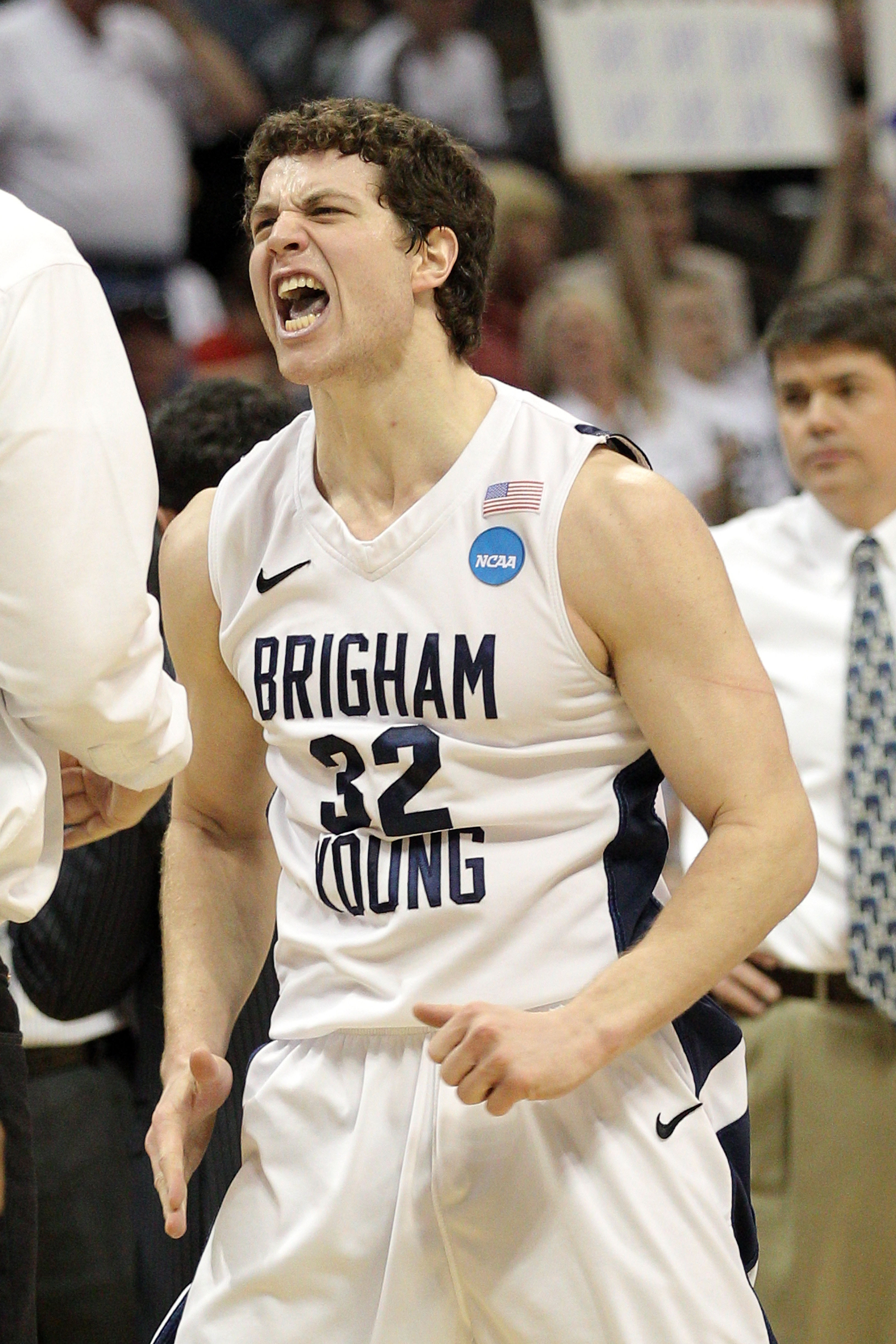 DENVER, CO - MARCH 19:  Jimmer Fredette #32 of the Brigham Young Cougars celebrates after a play against the Gonzaga Bulldogs during the third round of the 2011 NCAA men's basketball tournament at Pepsi Center on March 19, 2011 in Denver, Colorado.  (Phot