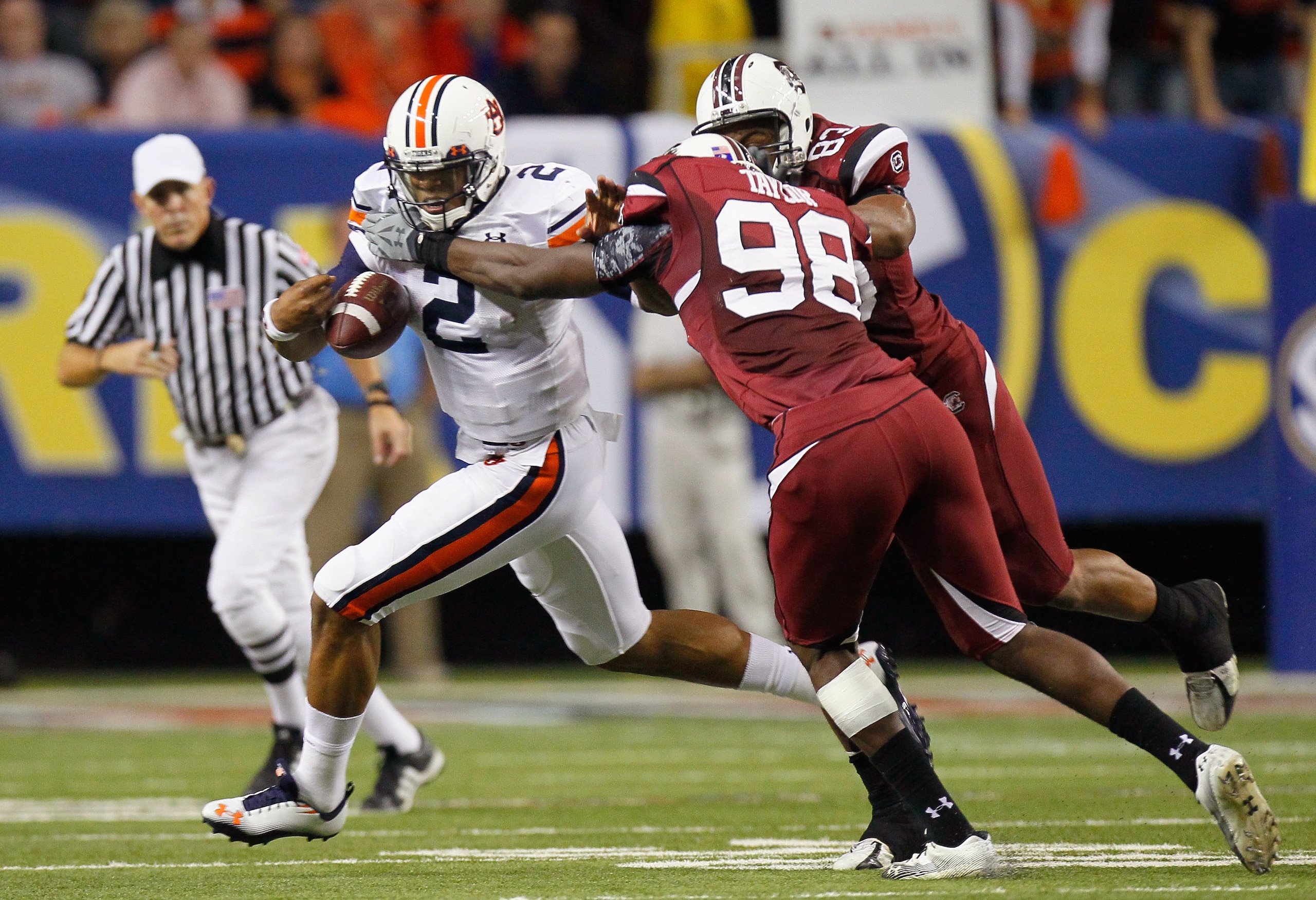 ATLANTA, GA - DECEMBER 04:  Devin Taylor #98 and Cliff Matthews #83 of the South Carolina Gamecocks force a fumble by quarterback Cam Newton #2 of the Auburn Tigers during the 2010 SEC Championship at Georgia Dome on December 4, 2010 in Atlanta, Georgia.