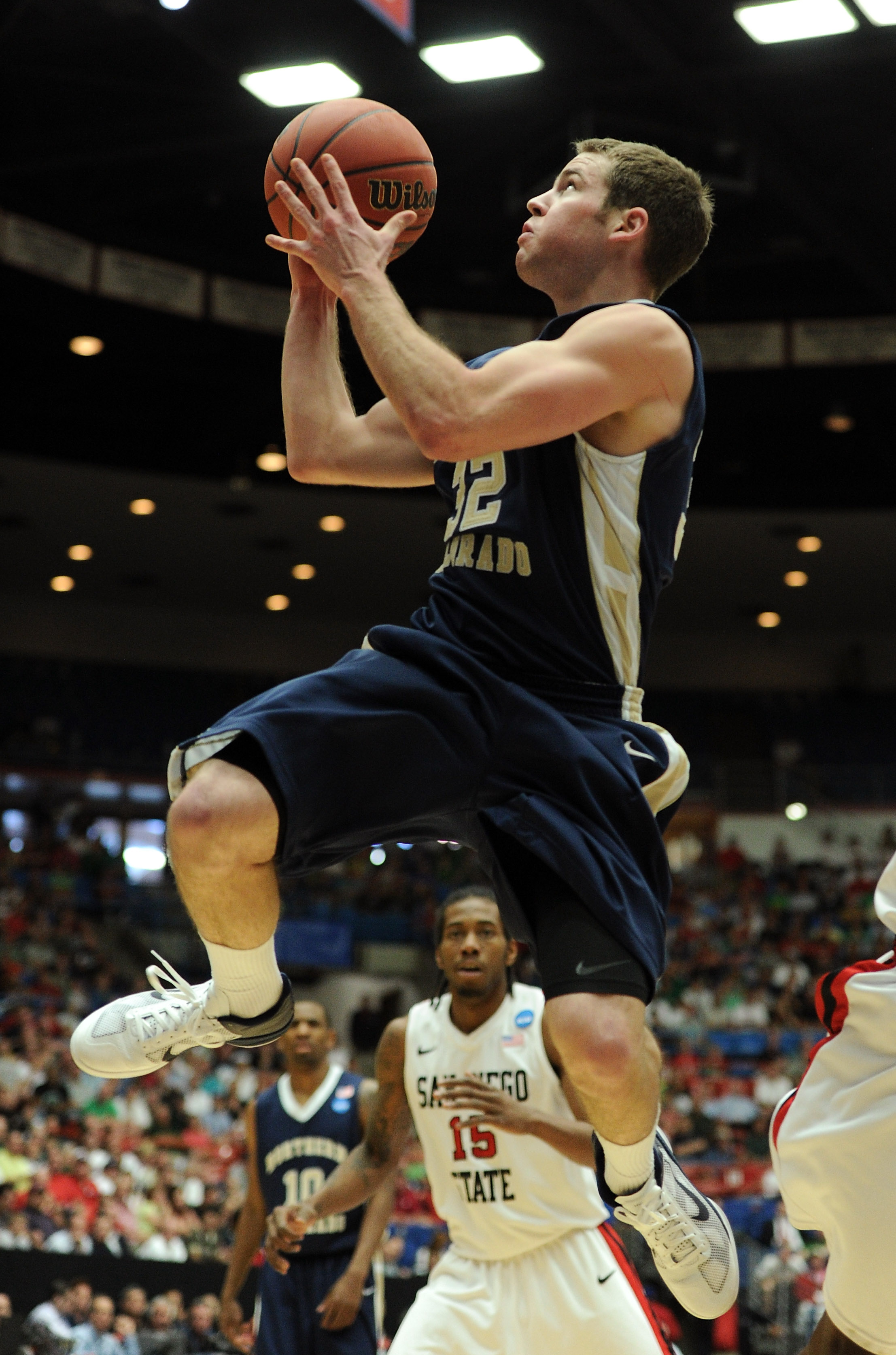 TUCSON, AZ - MARCH 17: Devon Beitzel #32 of the Northern Colorado Bears shoots in front of Kawhi Leonard #15 of the San Diego State Aztecs during the second round of the 2011 NCAA men's basketball tournament at McKale Center on March 17, 2011 in Tucson,