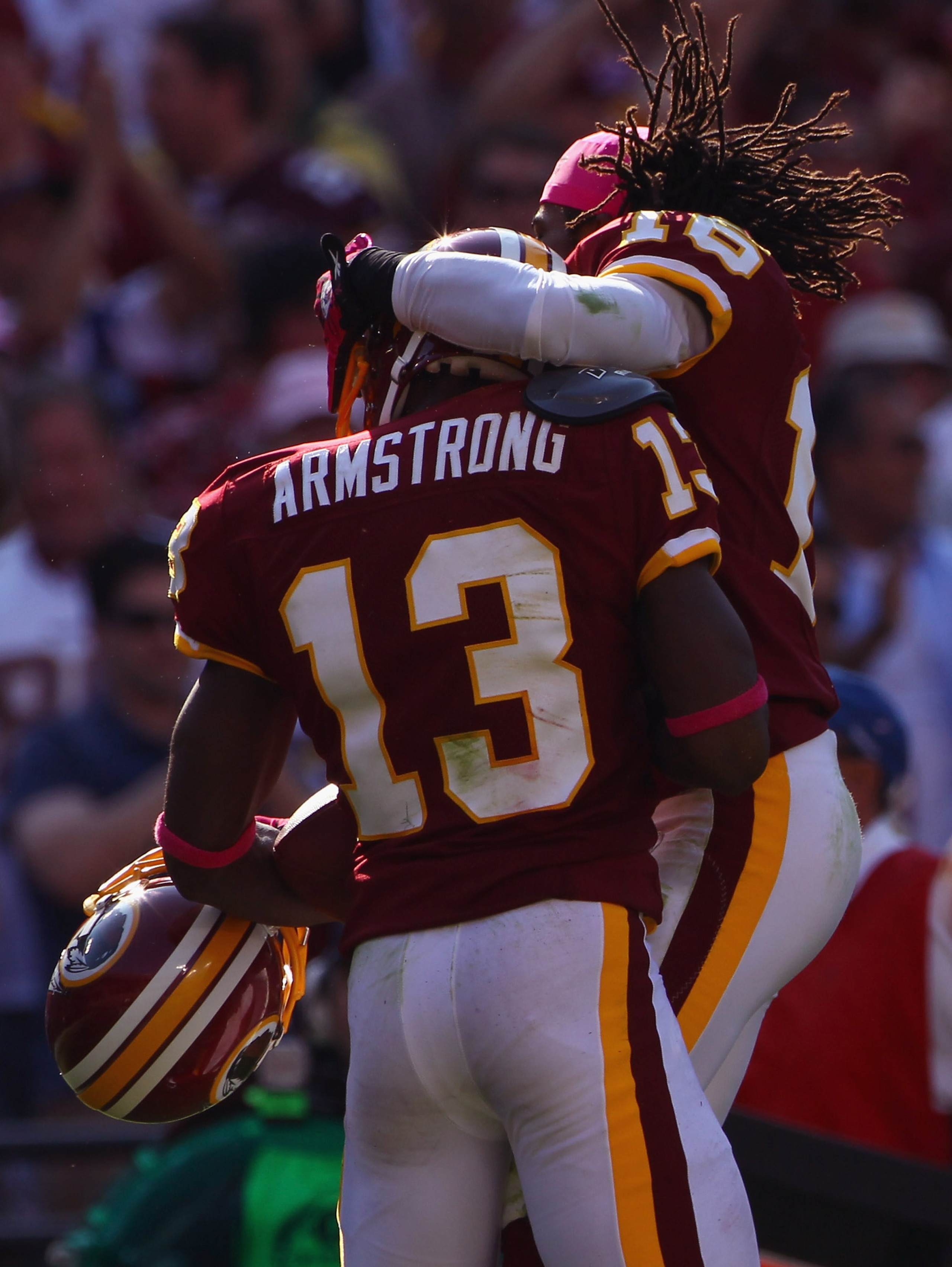 LANDOVER, MD - OCTOBER 10:  Wide receiver Anthony Armstrong #13 of the Washington Redskins celebrates with teammate Brandon Banks #16 after Armstrong caught a touchdown pass in the fourth quarter against the Green Bay Packers at FedExField on October 10,