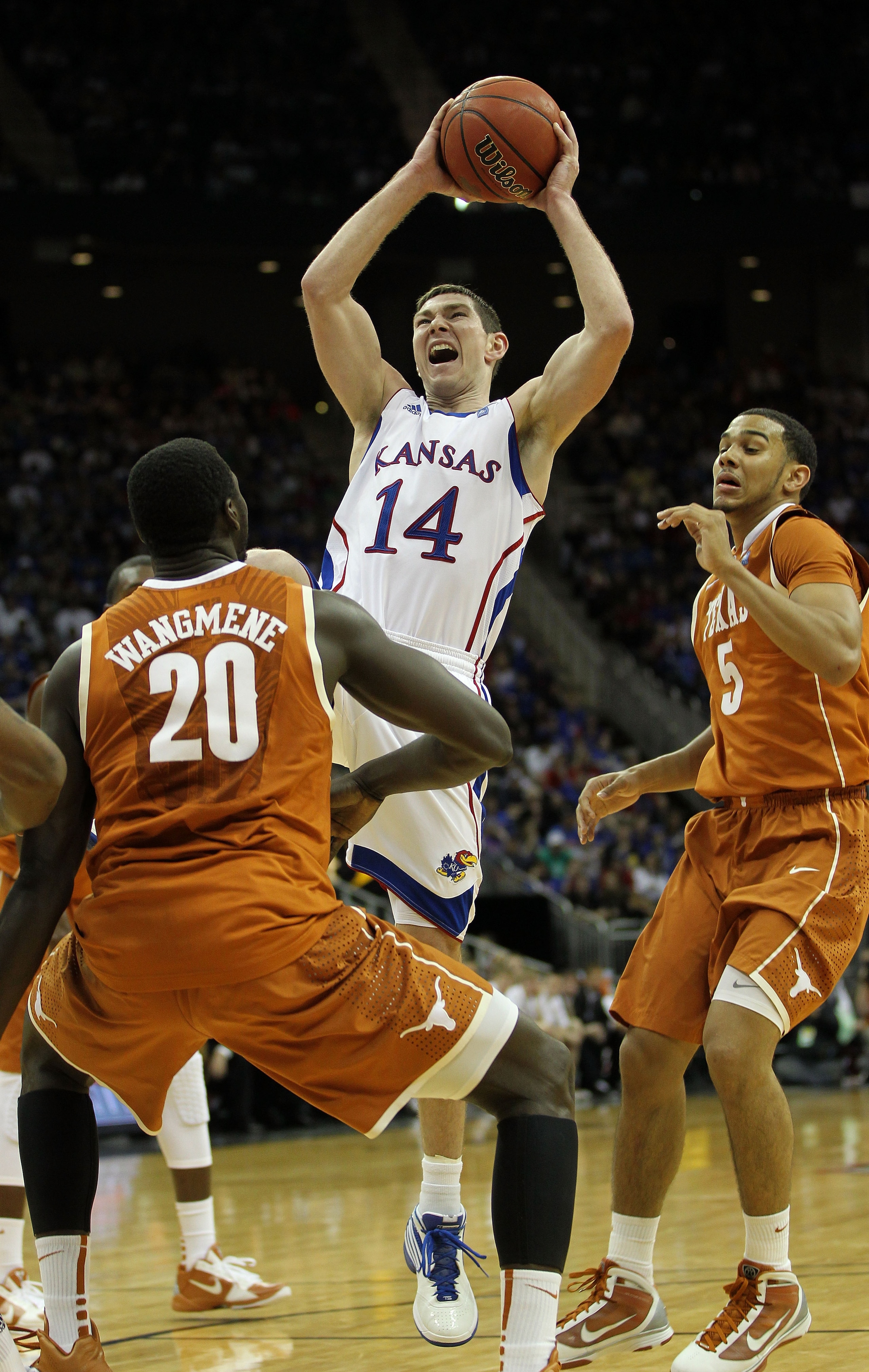 KANSAS CITY, MO - MARCH 12:  Tyrel Reed #14 of the Kansas Jayhawks goes up for a shot against the Texas Longhorns during the 2011 Phillips 66 Big 12 Men's Basketball Tournament championship game at Sprint Center on March 12, 2011 in Kansas City, Missouri.