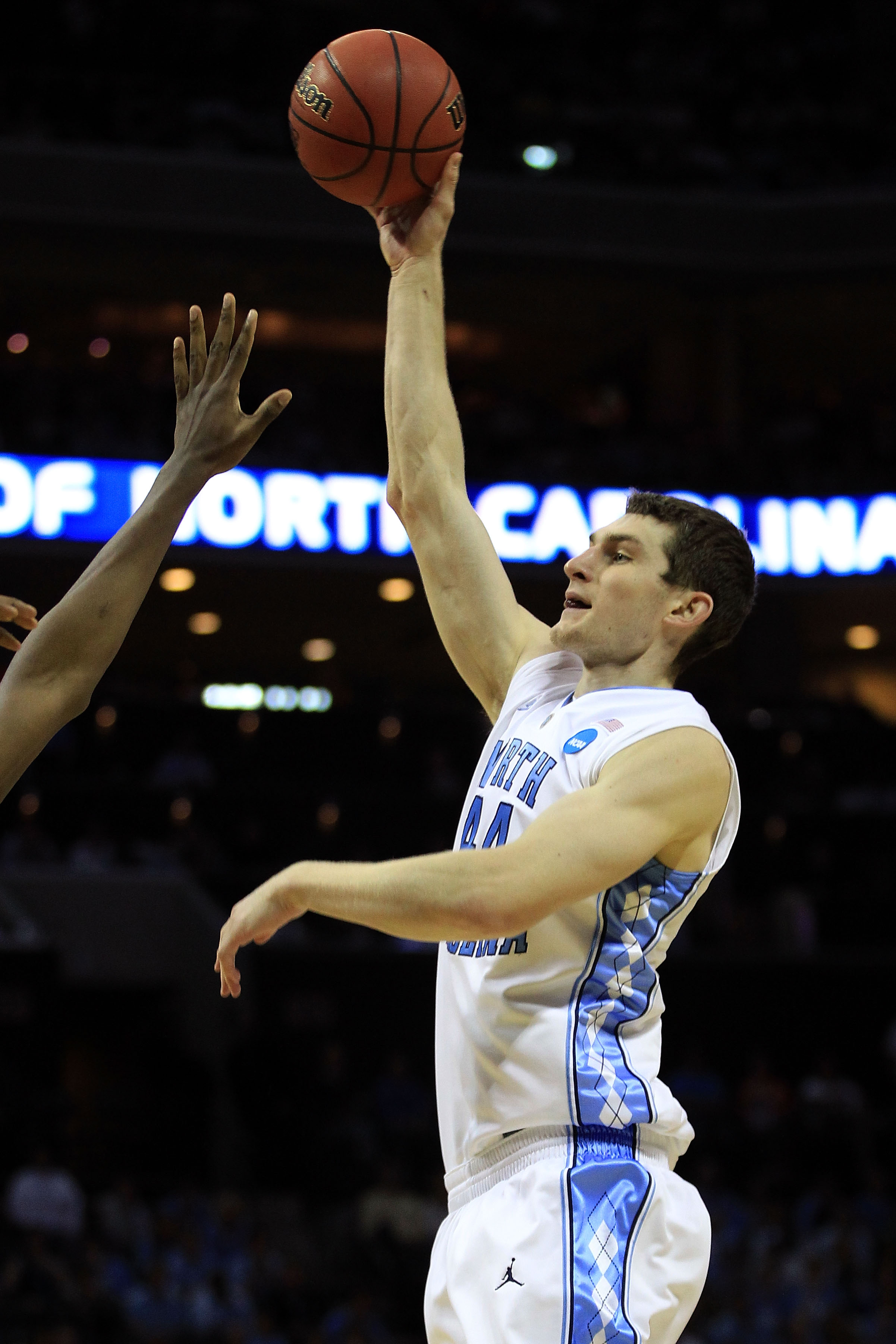 CHARLOTTE, NC - MARCH 20: Tyler Zeller #44 of the North Carolina Tar Heels shoots over a Washington Huskies defender during the third round of the 2011 NCAA men's basketball tournament at Time Warner Cable Arena on March 20, 2011 in Charlotte, North Caro