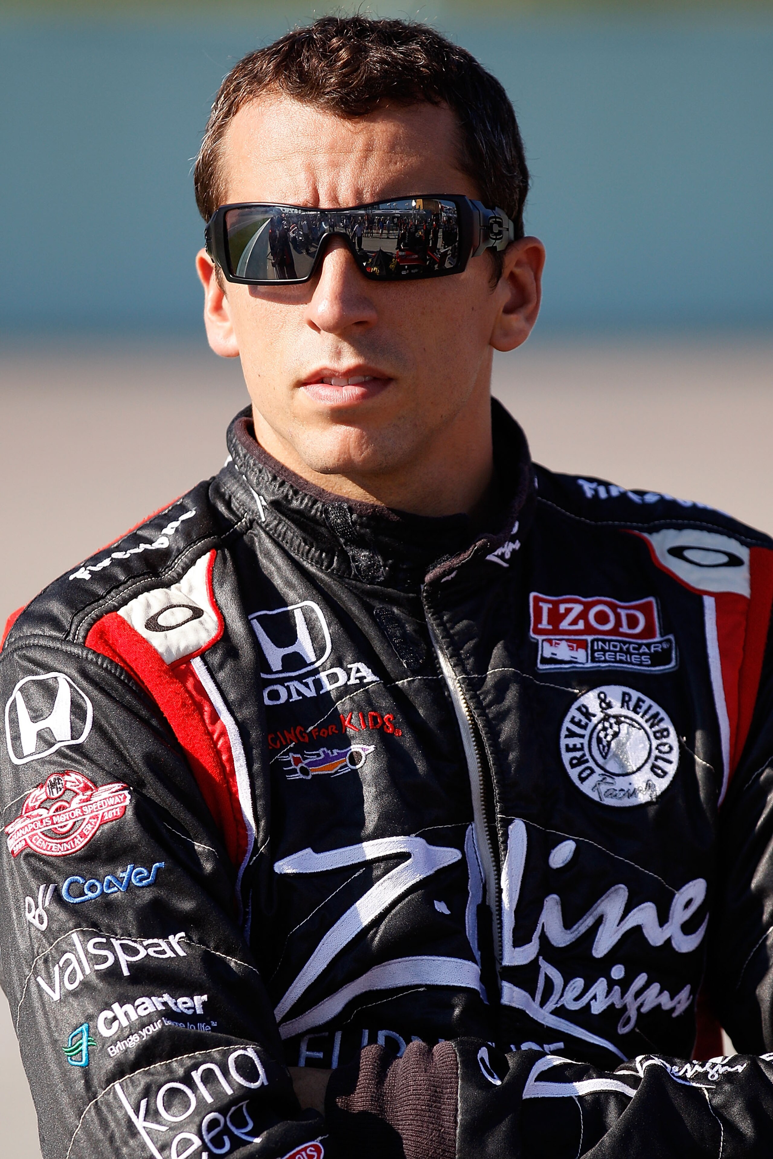 HOMESTEAD, FL - OCTOBER 01:  Justin Wilson of England, driver of the #22 Team Z-Line Designs Dallara Honda stands on pit road during qualifying for the IZOD IndyCar Series Cafes do Brasil Indy 300 at Homestead-Miami Speedway on October 1, 2010 in Homestea
