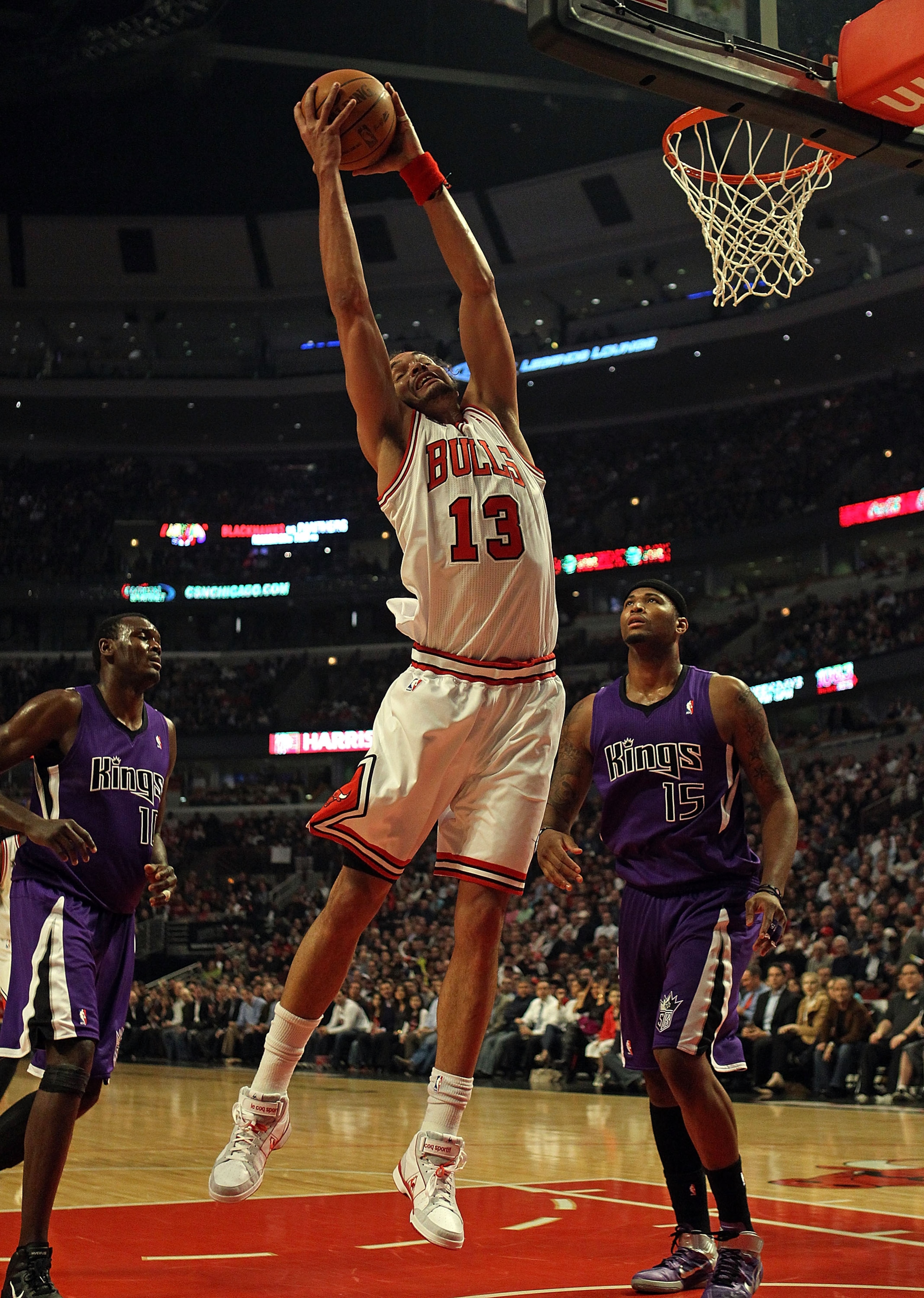 CHICAGO, IL - MARCH 21: Joakim Noah #13 of the Chicago Bulls grabs a rebound over Samuel Dalembert #10 (L) and DeMarcus Cousins #15 of the Sacramento Kings at the United Center on March 21, 2011 in Chicago, Illinois. NOTE TO USER: User expressly acknowled
