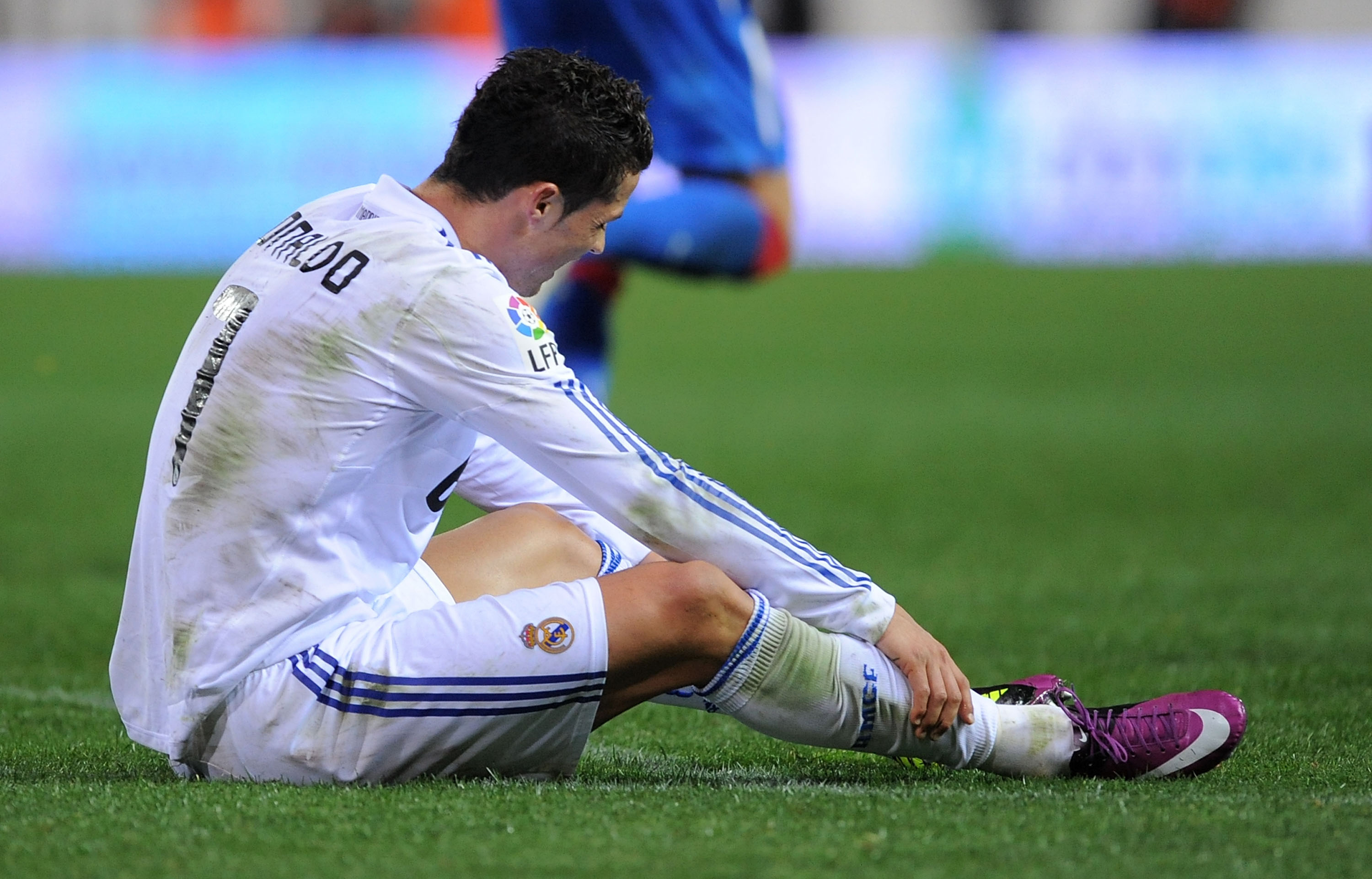 MADRID, SPAIN - MARCH 19:  Cristiano Ronaldo of Real Madrid reacts after taking a fall during the La Liga match between Atletico Madrid and Real Madrid at Vicente Calderon Stadium on March 19, 2011 in Madrid, Spain.  (Photo by Denis Doyle/Getty Images)