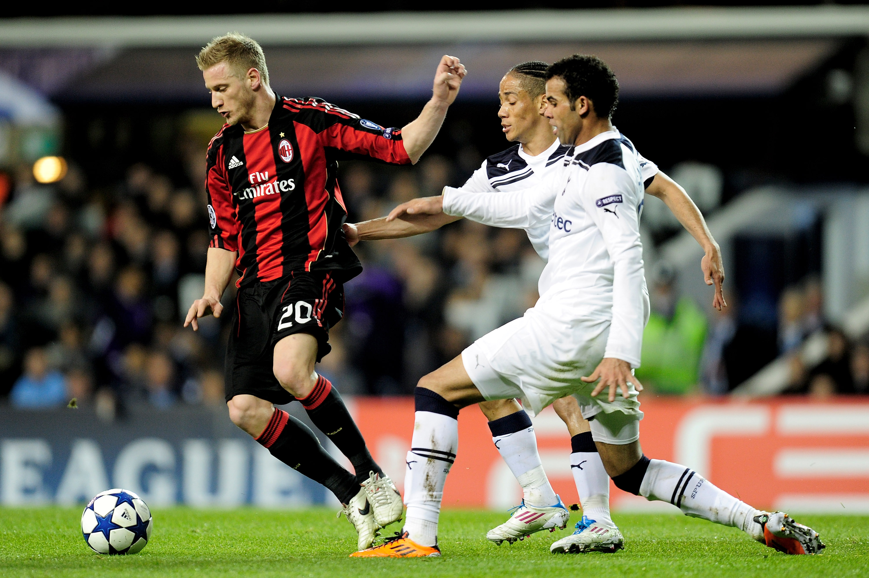 LONDON, ENGLAND - MARCH 09:  Steven Pienaar (2R) and Sandro (R) of Tottenham challenge Ignazio Abate of Milan during the UEFA Champions League round of 16 second leg match between Tottenham Hotspur and AC Milan at White Hart Lane on March 9, 2011 in Londo