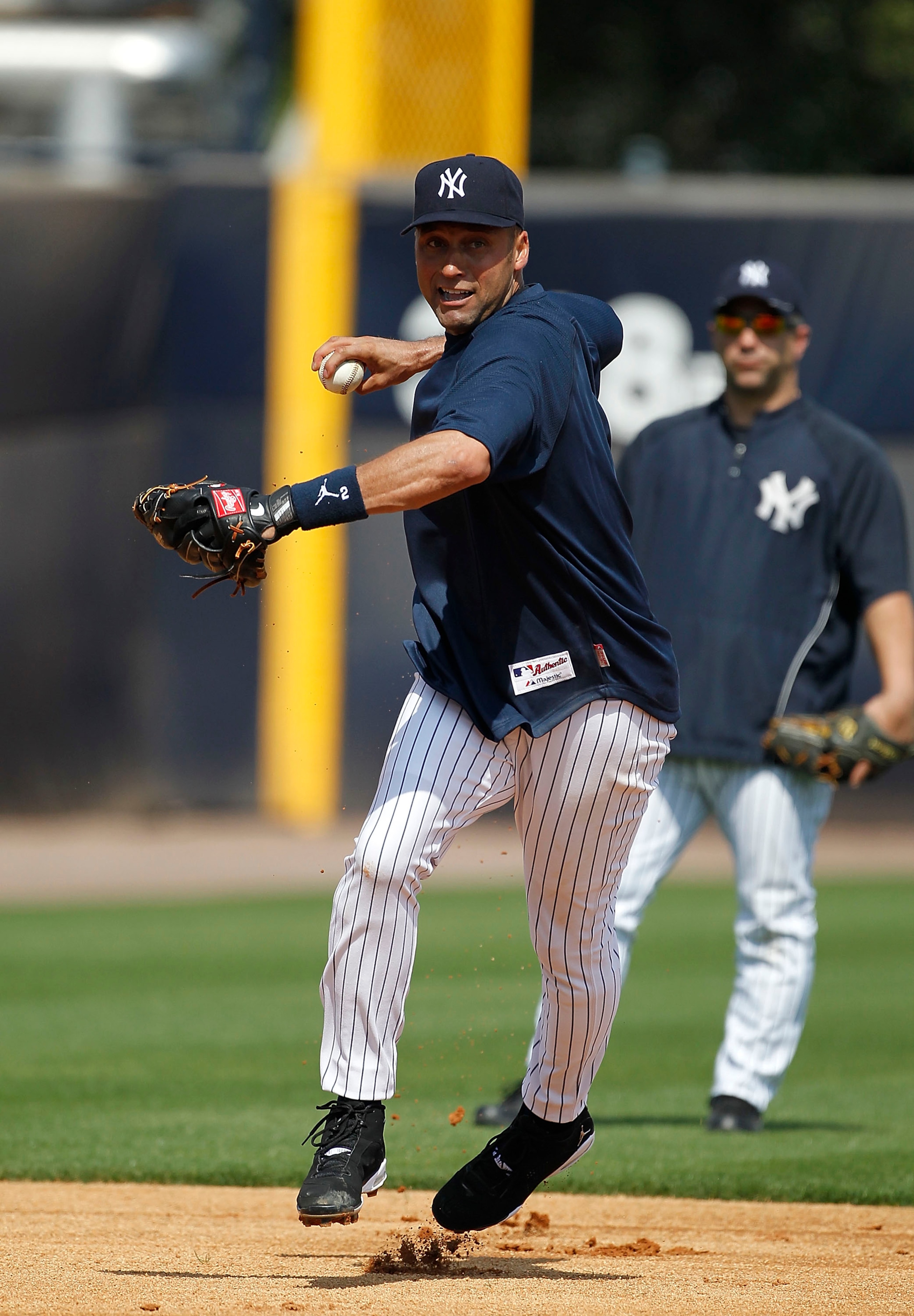 TAMPA, FL - FEBRUARY 20: Derek Jeter #2 of the New York Yankees fields a ground ball during the first full team workout of Spring Training on February 20, 2011 at the George M. Steinbrenner Field in Tampa, Florida.  (Photo by Leon Halip/Getty Images)