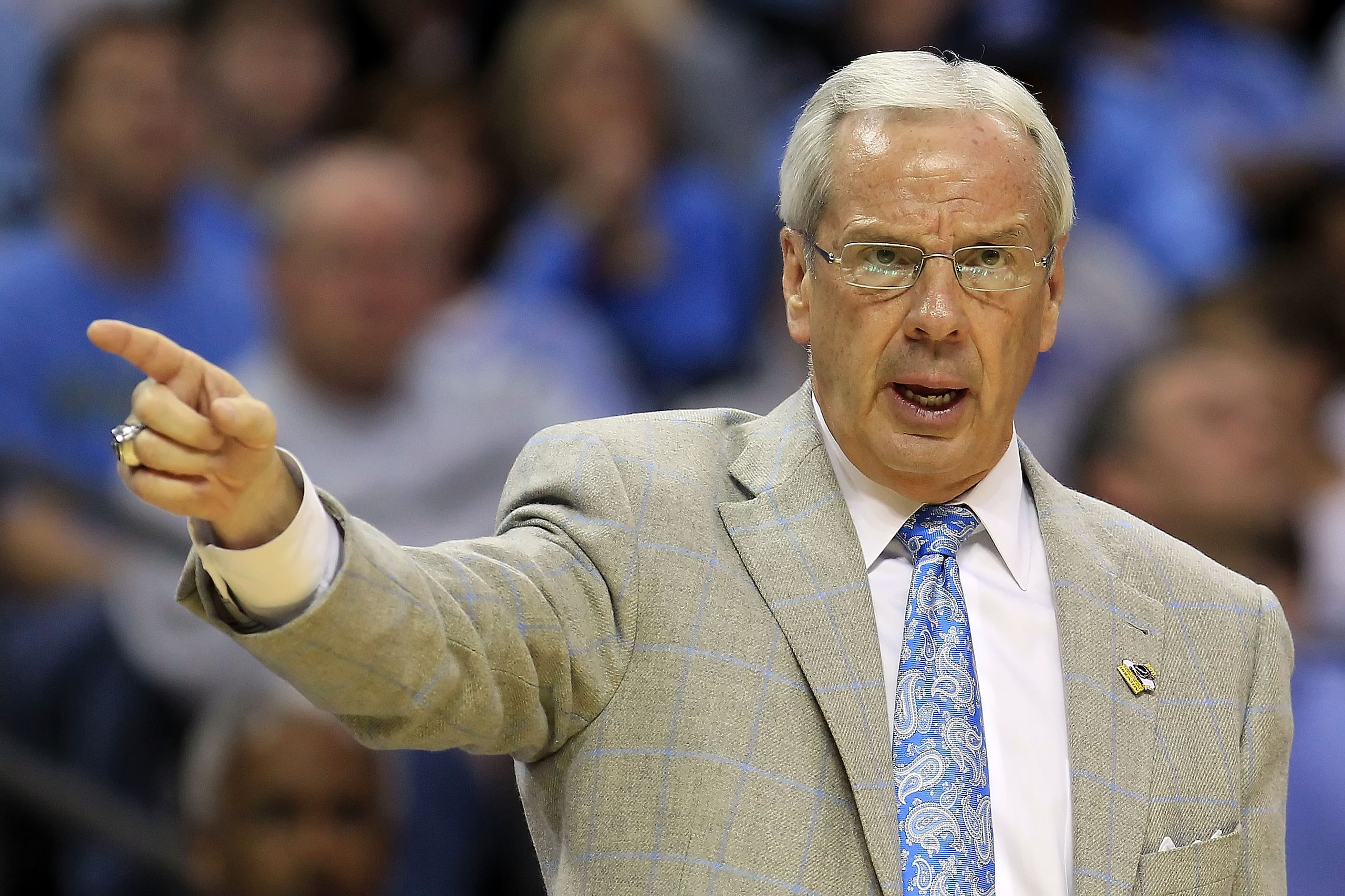 CHARLOTTE, NC - MARCH 18:  Head coach Roy Williams of the North Carolina Tar Heels points in the second half while taking on the Long Island Blackbirds during the second round of the 2011 NCAA men's basketball tournament at Time Warner Cable Arena on Marc