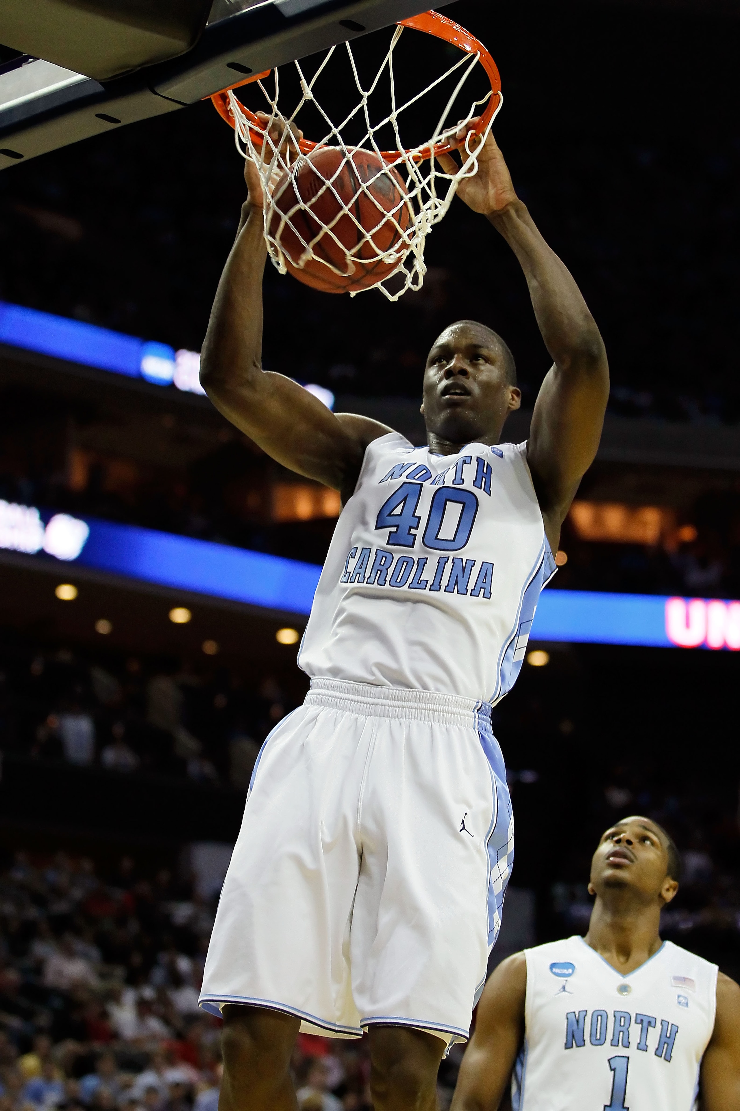 CHARLOTTE, NC - MARCH 18:  Harrison Barnes #40 of the North Carolina Tar Heels dunks the ball in the first half while taking on the Long Island Blackbirds during the second round of the 2011 NCAA men's basketball tournament at Time Warner Cable Arena on M