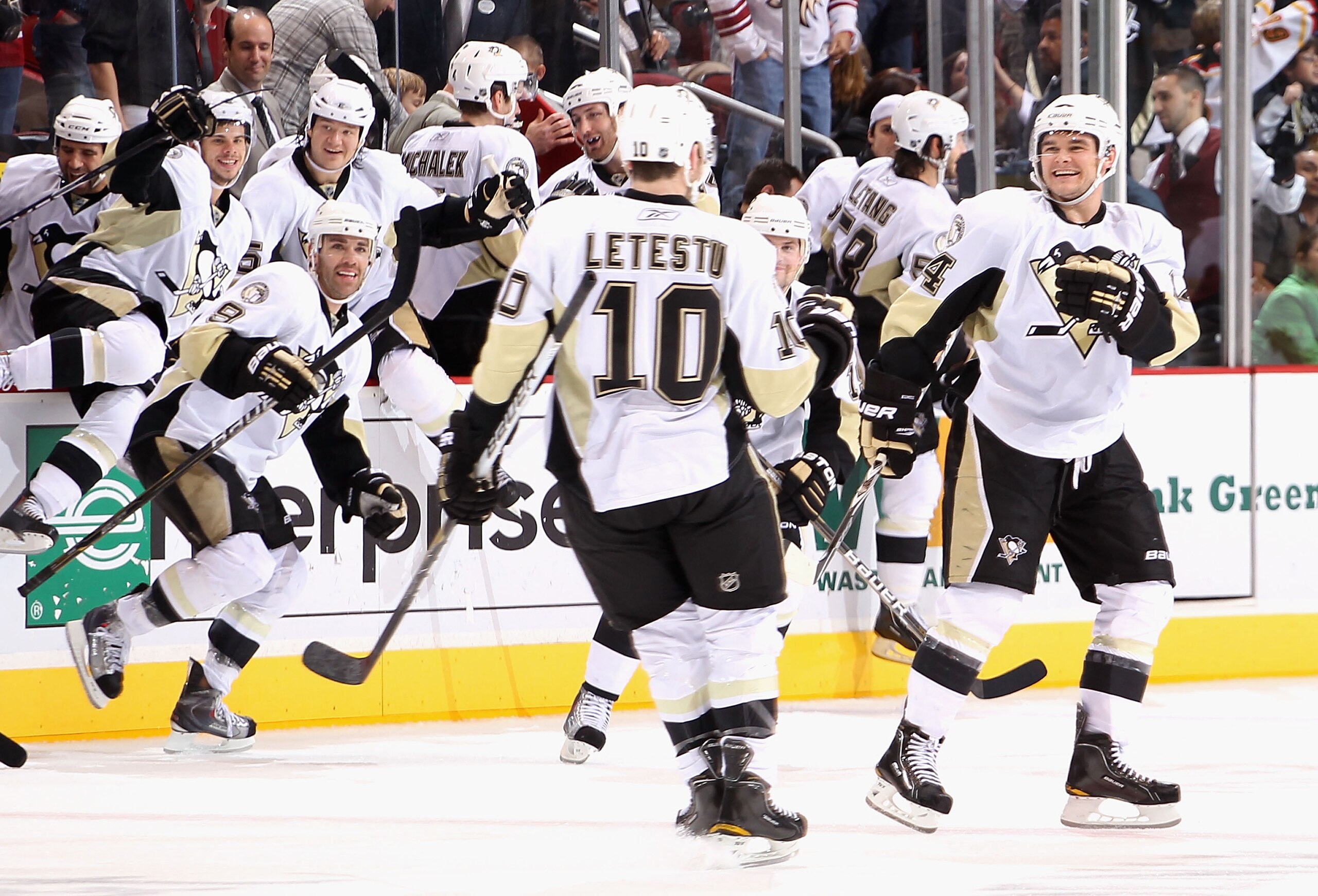 GLENDALE, AZ - NOVEMBER 06:  Chris Kunitz #14 (R) of the Pittsburgh Penguins celebrates with teammate Mark Letestu after Letestu scored the game winning shoot out goal against the Phoenix Coyotes during the NHL game at Jobing.com Arena on November 6, 2010