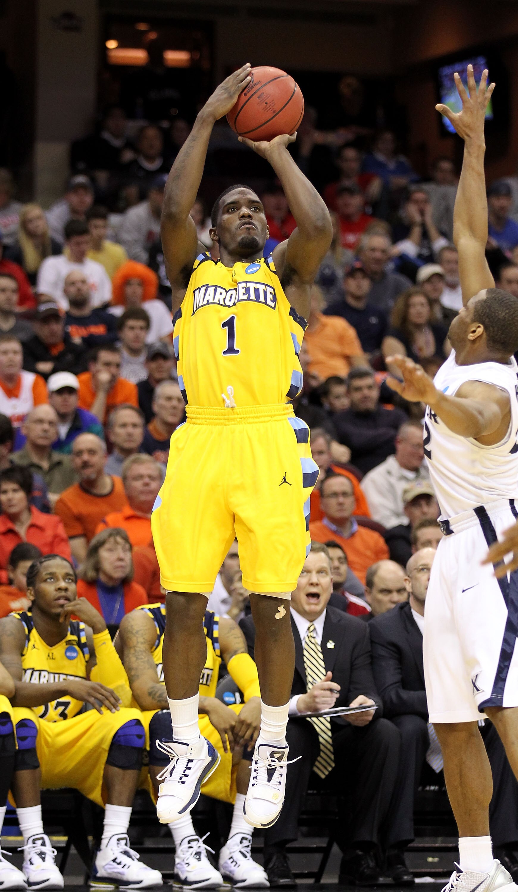 CLEVELAND, OH - MARCH 18: Darius Johnson-Odom #1 of the Marquette Golden Eagles shoots the ball against the Xavier Musketeers during the second round of the 2011 NCAA men's basketball tournament at Quicken Loans Arena on March 18, 2011 in Cleveland, Ohio.