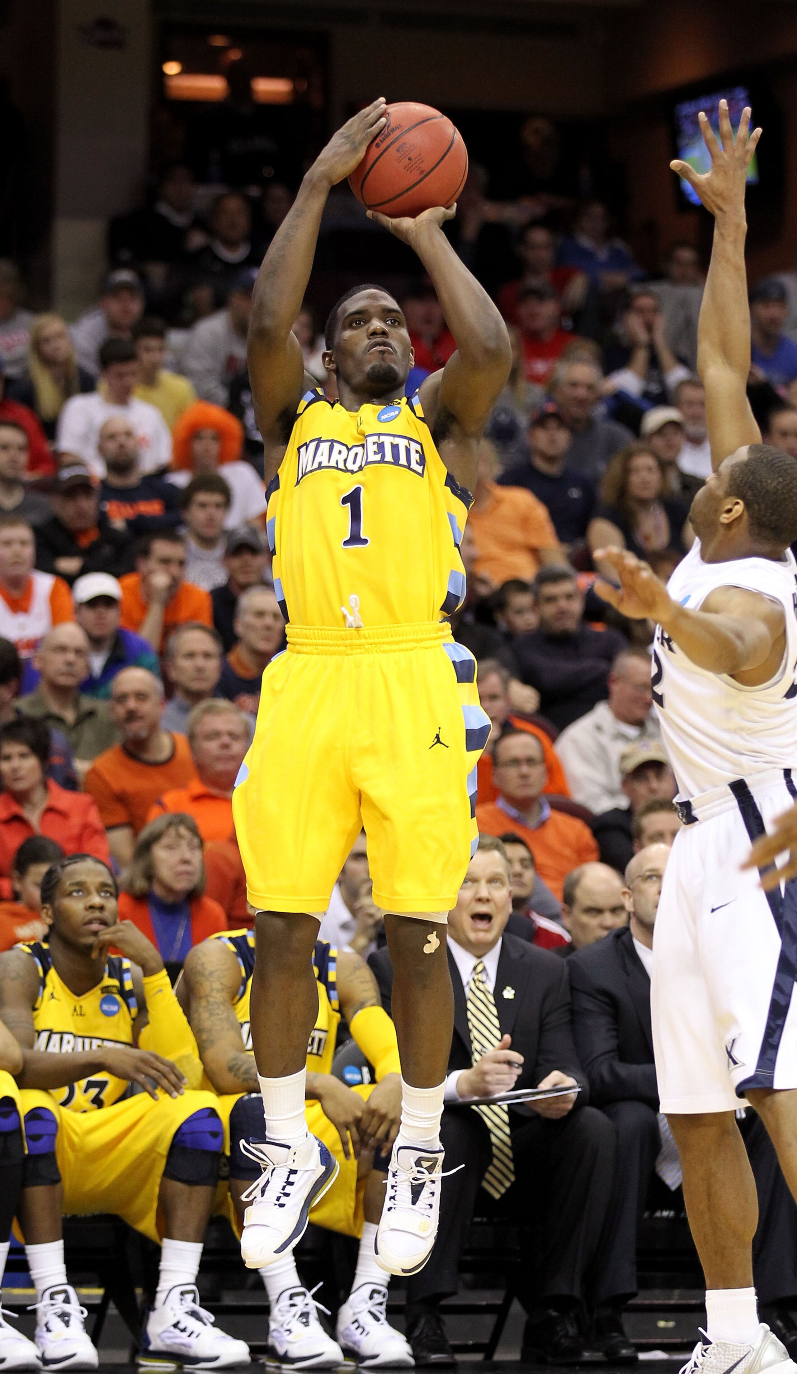 CLEVELAND, OH - MARCH 18: Darius Johnson-Odom #1 of the Marquette Golden Eagles shoots the ball against the Xavier Musketeers during the second round of the 2011 NCAA men's basketball tournament at Quicken Loans Arena on March 18, 2011 in Cleveland, Ohio.