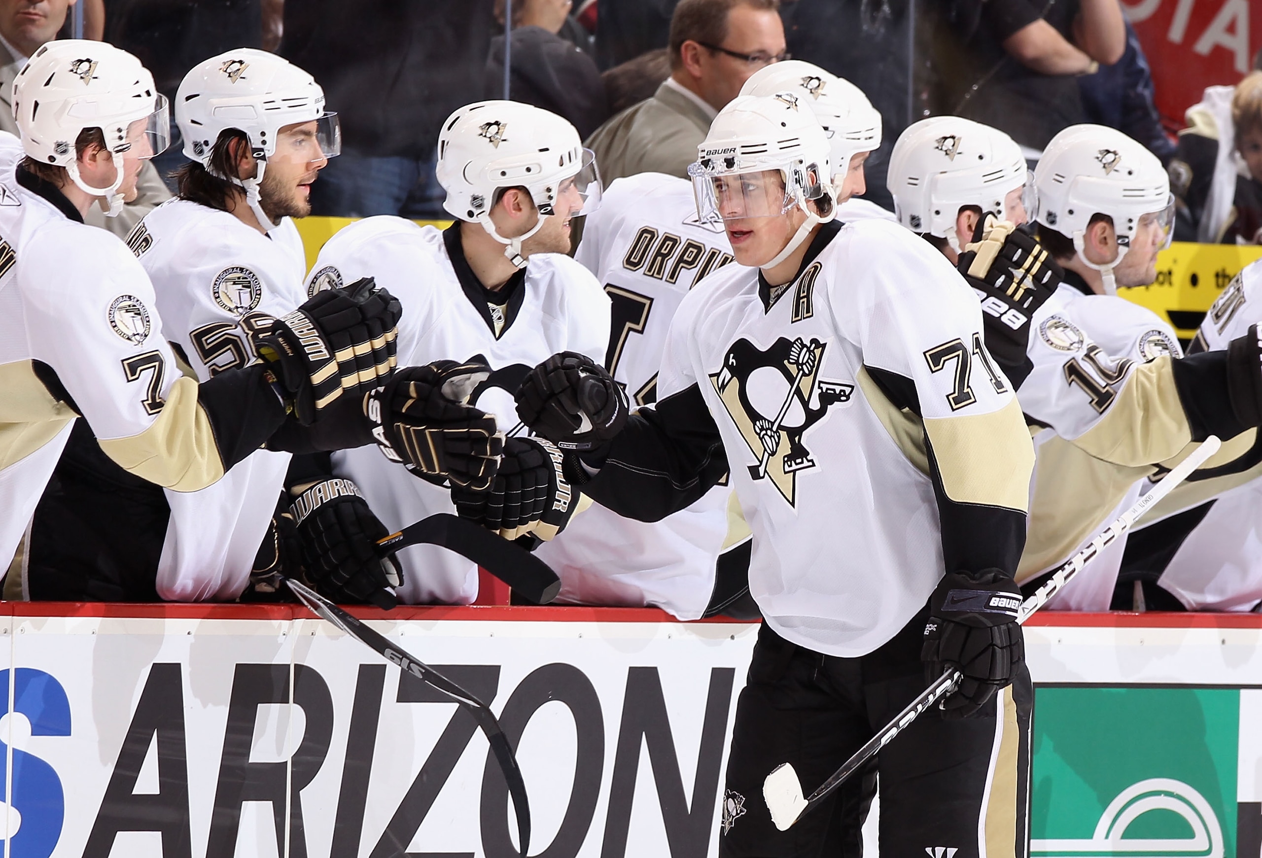 GLENDALE, AZ - NOVEMBER 06:  Evgeni Malkin #71 of the Pittsburgh Penguins celebrates with teammates after scoring against the Phoenix Coyotes during the NHL game at Jobing.com Arena on November 6, 2010 in Glendale, Arizona.  The Penguins defeated the Coyo