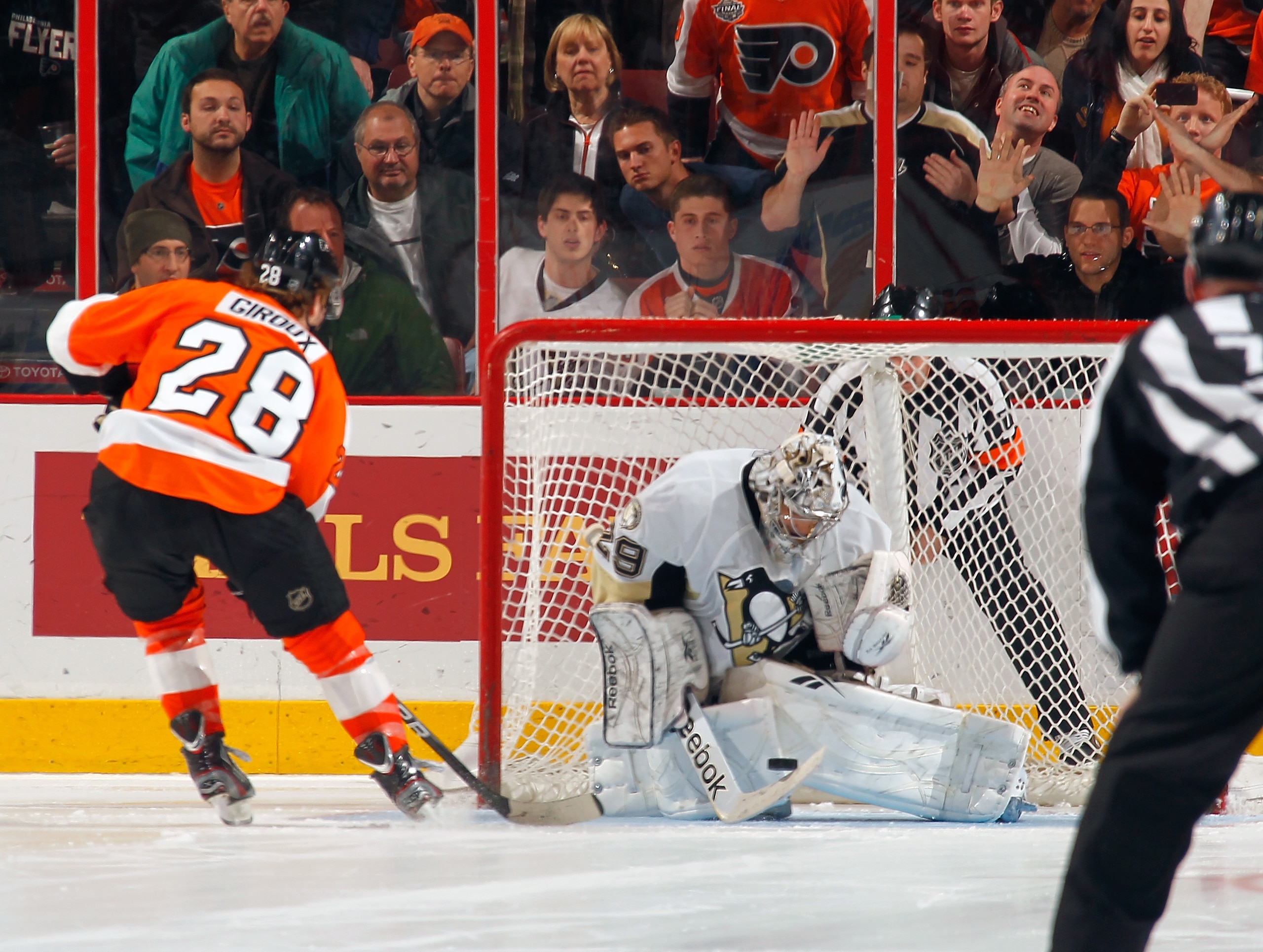 PHILADELPHIA - MARCH 24:  Marc Andre Fleury #29 of the Pittsburgh Penguins makes a save against Claude Giroux #28 of the Philadelphia Flyers during the shootout on March 24, 2011 at the Wells Fargo Center in Philadelphia, Pennsylvania.  (Photo by Lou Capo