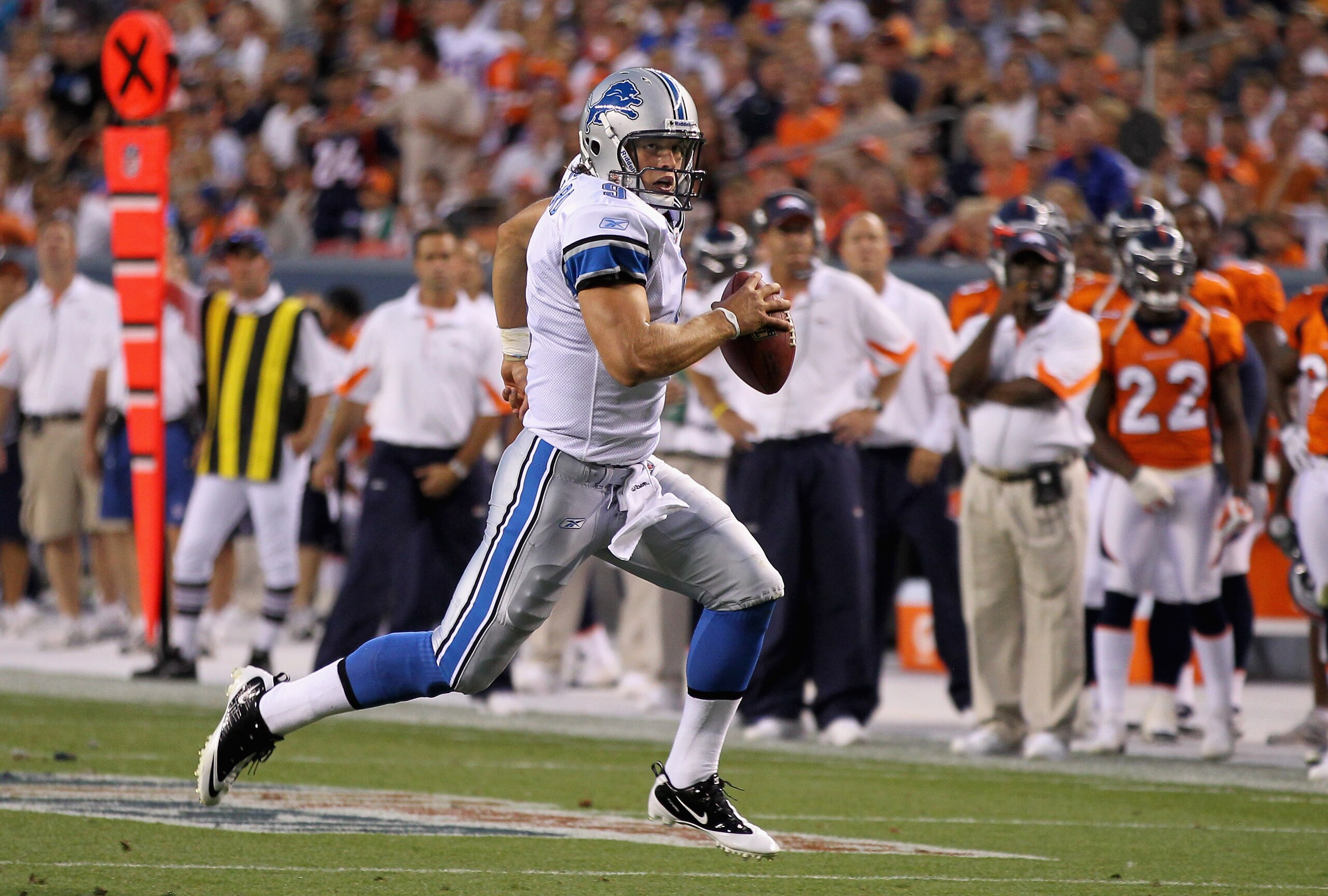 DENVER - AUGUST 21:  Quarterback Matthew Stafford #9 of the Detroit Lions scrambles against the Denver Broncos during preseason NFL action at INVESCO Field at Mile High on August 21, 2010 in Denver, Colorado. The Lions defeated the Broncos 25-20.  (Photo
