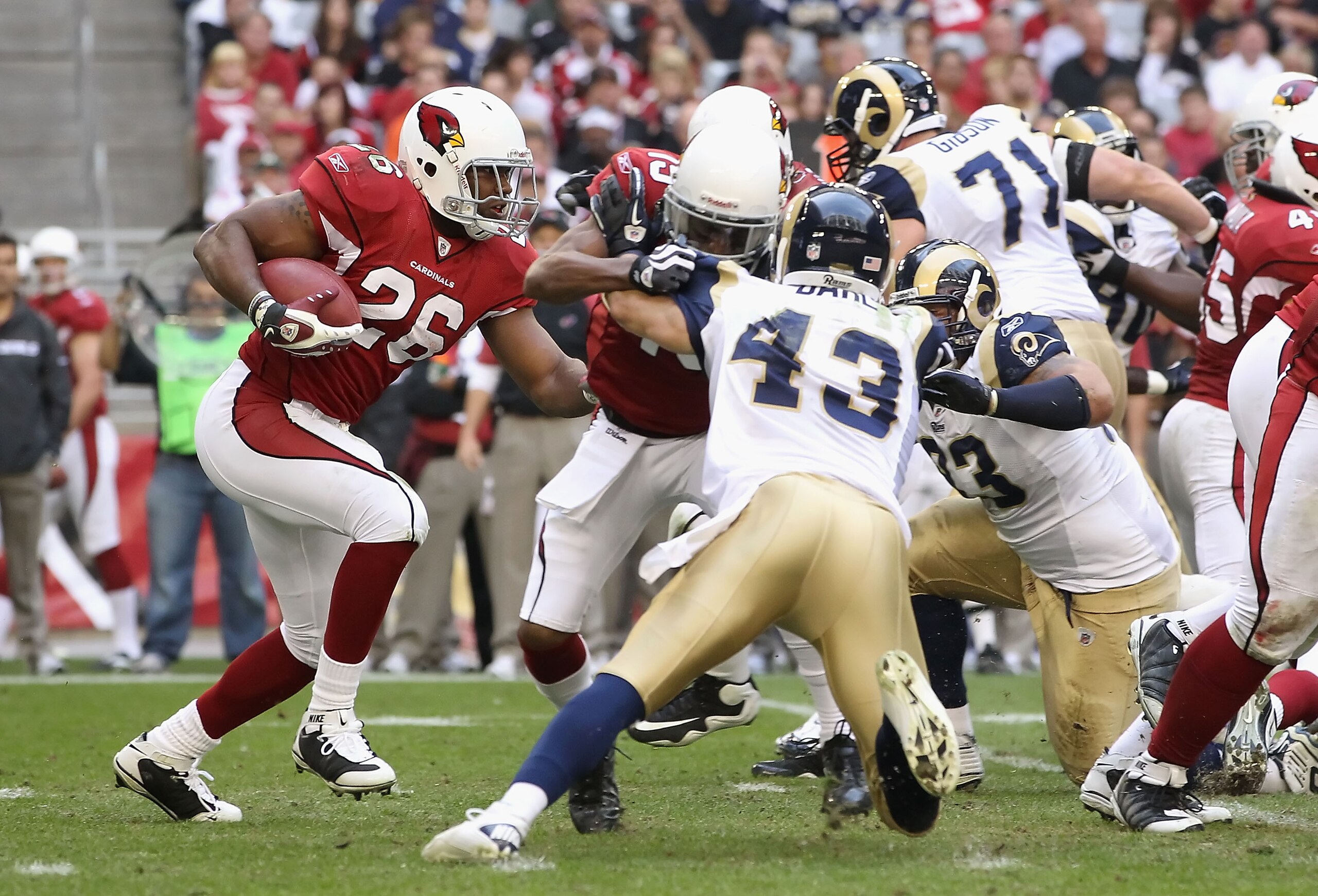 GLENDALE, AZ - DECEMBER 05:  Runningback Beanie Wells #26 of the Arizona Cardinals rushes the football during the NFL game against the St. Louis Rams at the University of Phoenix Stadium on December 5, 2010 in Glendale, Arizona.  The Rams defeated the Car