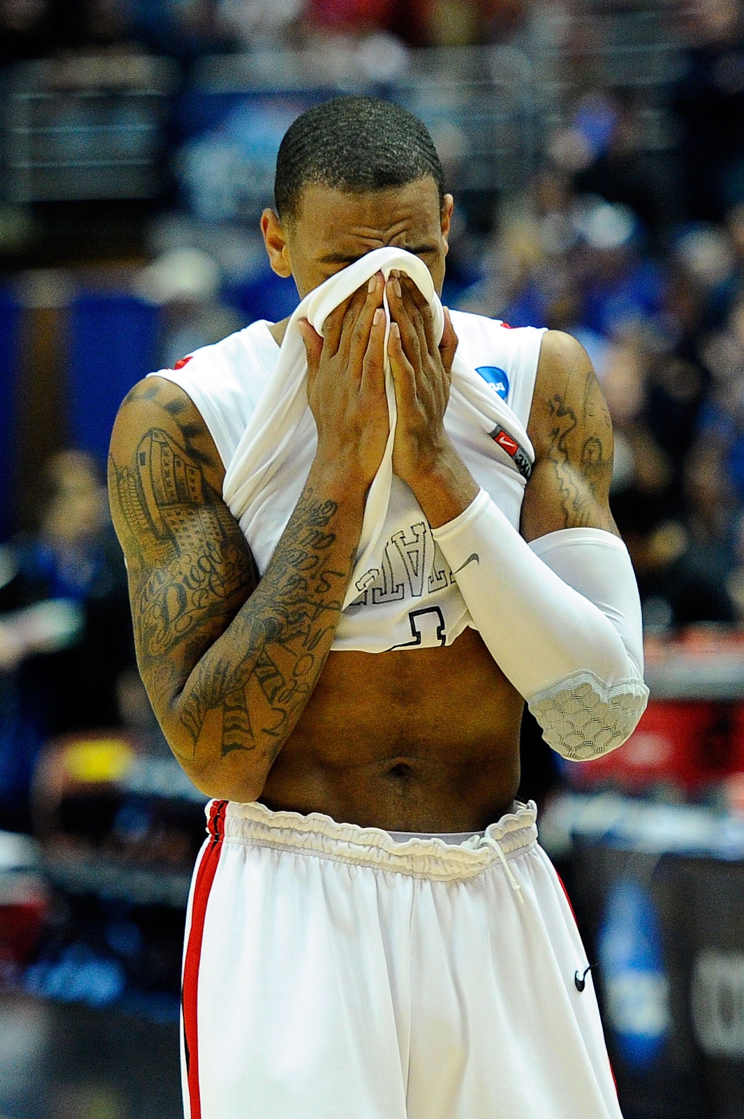 ANAHEIM, CA - MARCH 24:  Billy White #32 of the San Diego State Aztecs walks off the court after losing against the Connecticut Huskies during the west regional semifinal of the 2011 NCAA men's basketball tournament at the Honda Center on March 24, 2011 i
