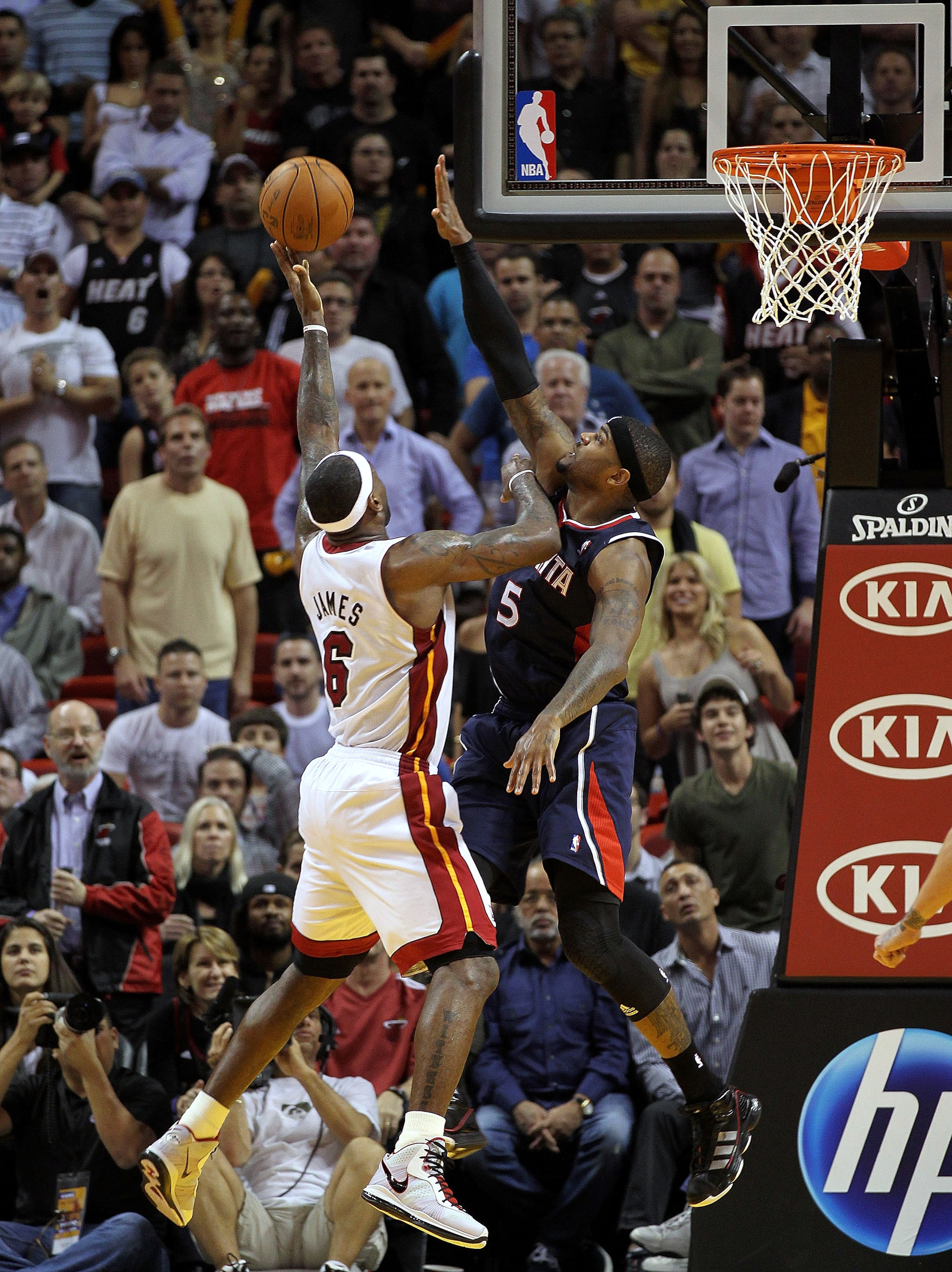 MIAMI, FL - JANUARY 18:  LeBron James #6 of the Miami Heat shoots over Josh Smith #5 of the Atlanta Hawks during a game at American Airlines Arena on January 18, 2011 in Miami, Florida. NOTE TO USER: User expressly acknowledges and agrees that, by downloa