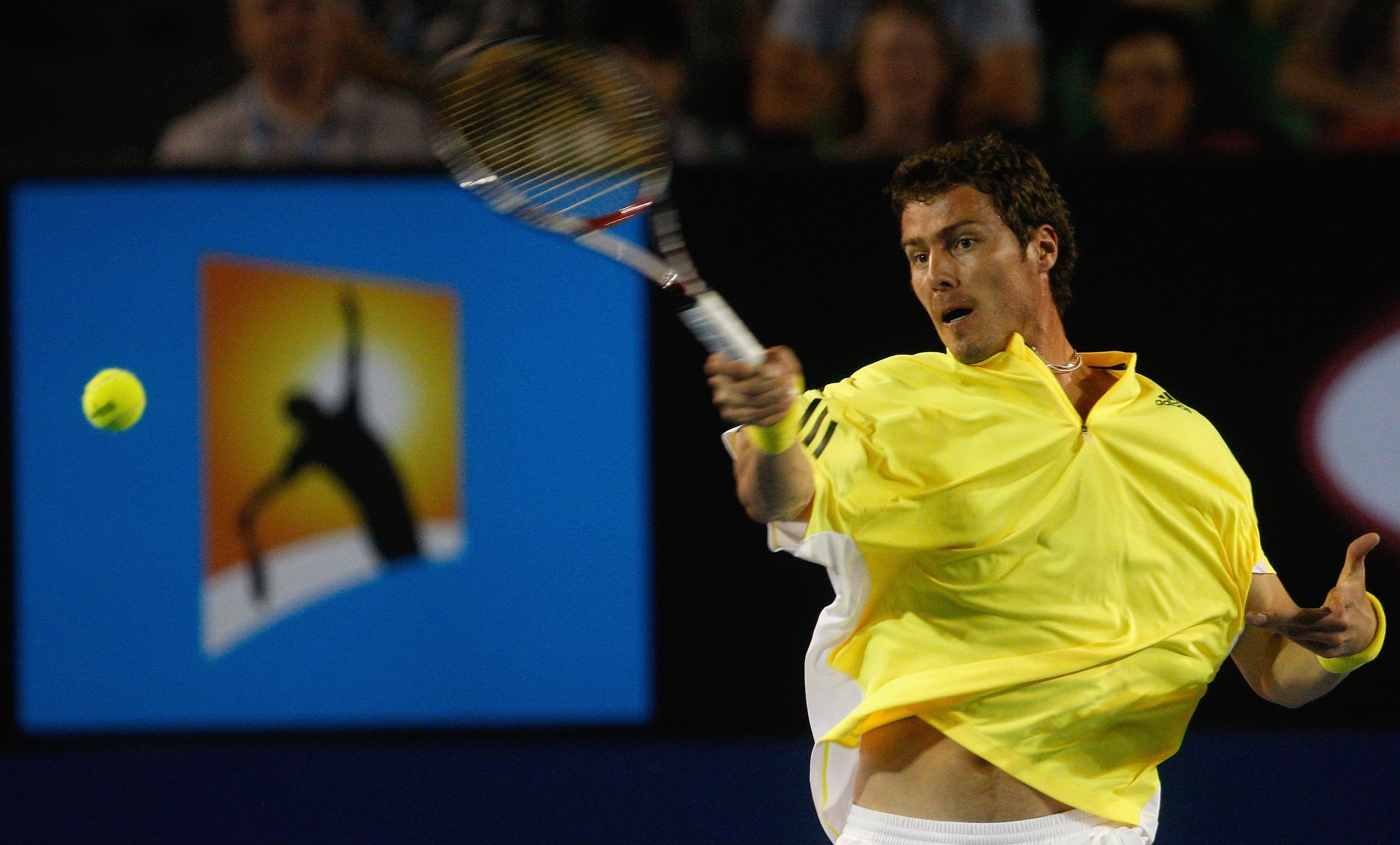 MELBOURNE, VICTORIA - JANUARY 23:  Marat Safin of Russia plays a forehand in his third round match against Roger Federer of Switzerland during day five of the 2009 Australian Open at Melbourne Park on January 23, 2009 in Melbourne, Australia.  (Photo by F