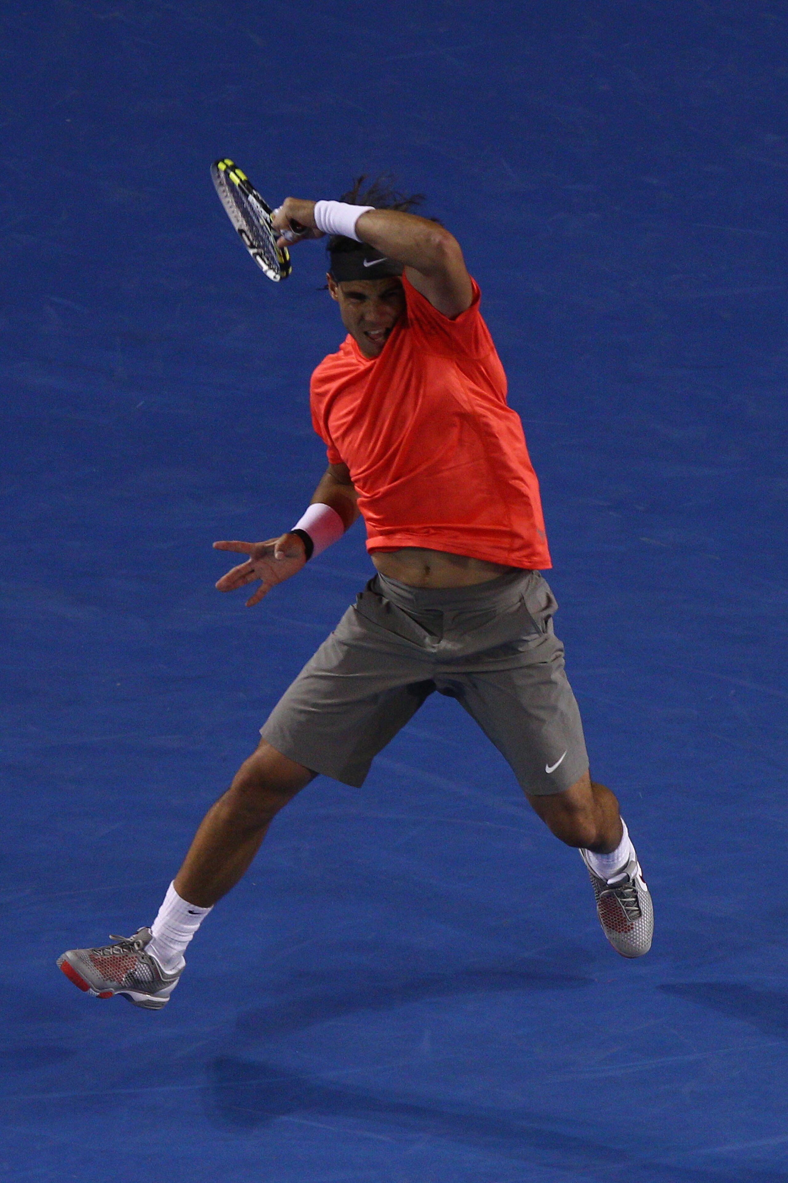 MELBOURNE, AUSTRALIA - JANUARY 24:  Rafael Nadal of Spain plays a forehand in his fourth round match against Marin Cilic of Croatia during day eight of the 2011 Australian Open at Melbourne Park on January 24, 2011 in Melbourne, Australia.  (Photo by Ryan