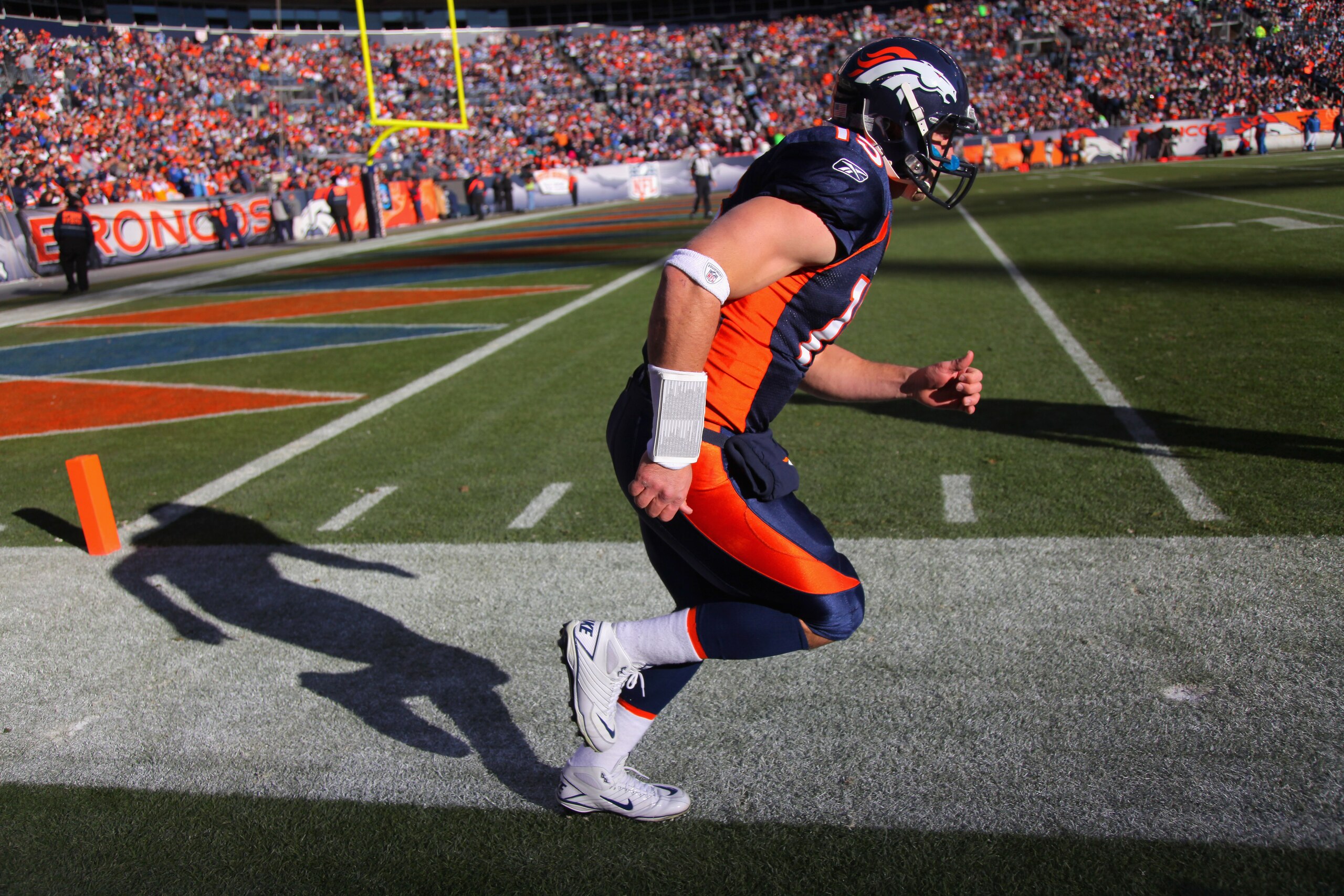 DENVER - JANUARY 02:  Quarterback Tim Tebow #15 of the Denver Broncos warms up prior to facing the San Diego Chargers at INVESCO Field at Mile High on January 2, 2011 in Denver, Colorado.  (Photo by Doug Pensinger/Getty Images)