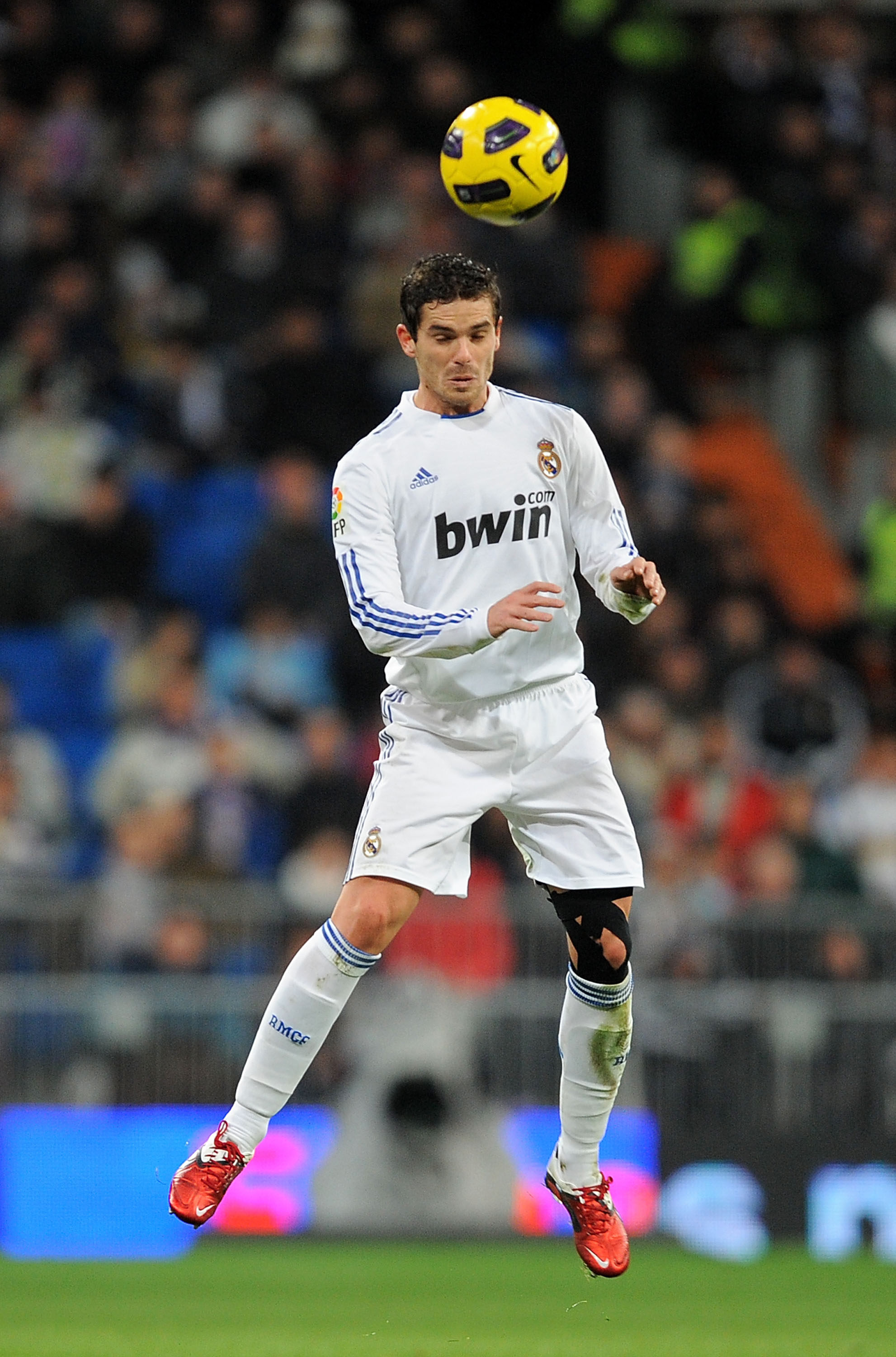 MADRID, SPAIN - JANUARY 23: Fernando Gago of Real Madrid heads the ball during the La Liga match between Real Madrid and Mallorca at Estadio Santiago Bernabeu on January 23, 2011 in Madrid, Spain.  (Photo by Denis Doyle/Getty Images)