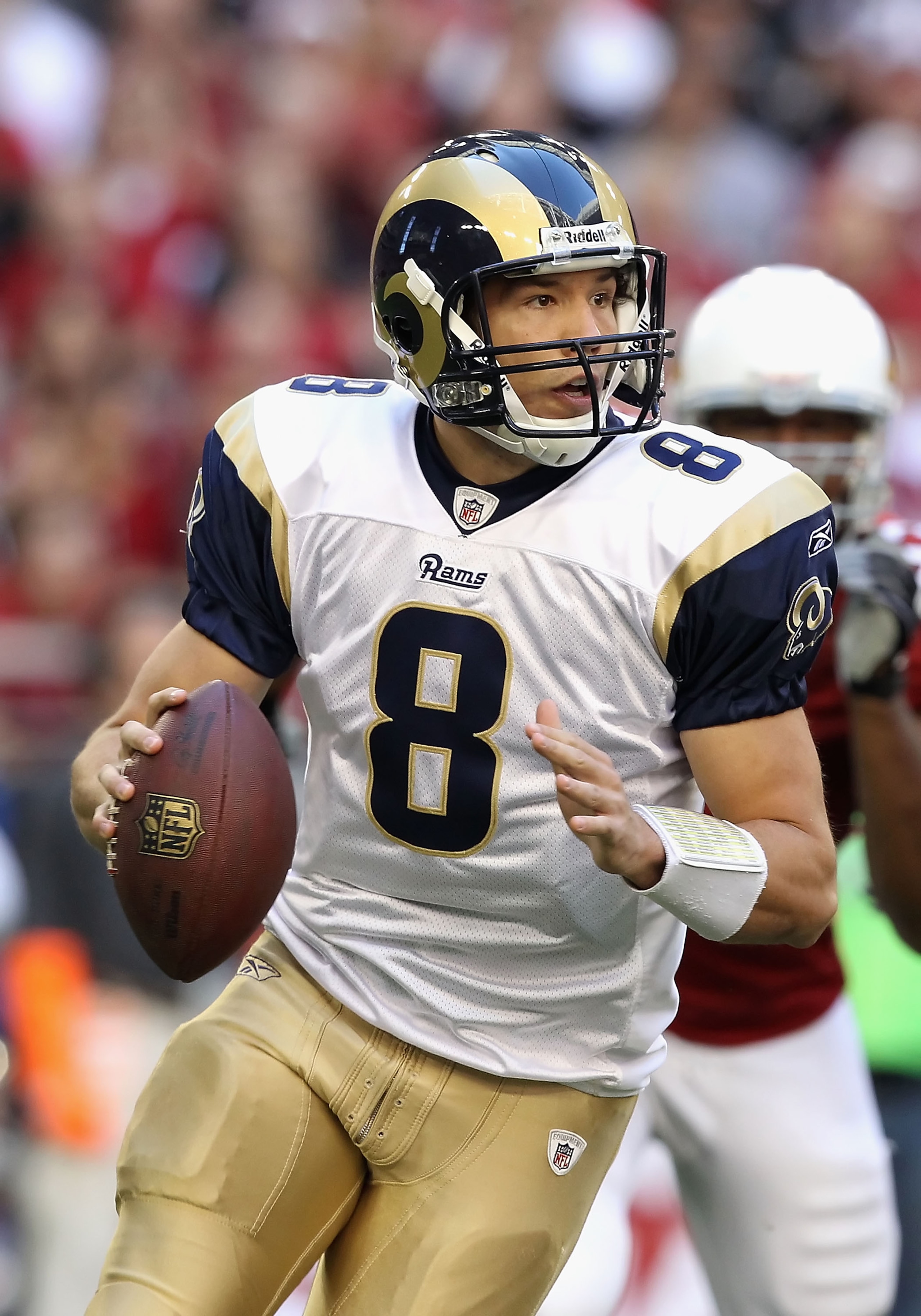 GLENDALE, AZ - DECEMBER 05: Quarterback Sam Bradford #8 of the St. Louis Rams scrambles to pass the football during the NFL game against the Arizona Cardinals at the University of Phoenix Stadium on December 5, 2010 in Glendale, Arizona. The Rams defeate GLENDALE, AZ - DECEMBER 05: Quarterback Sam Bradford #8 of the St. Louis Rams scrambles to pass the football during the NFL game against the Arizona Cardinals at the University of Phoenix Stadium on December 5, 2010 in Glendale, Arizona. The Rams defeate