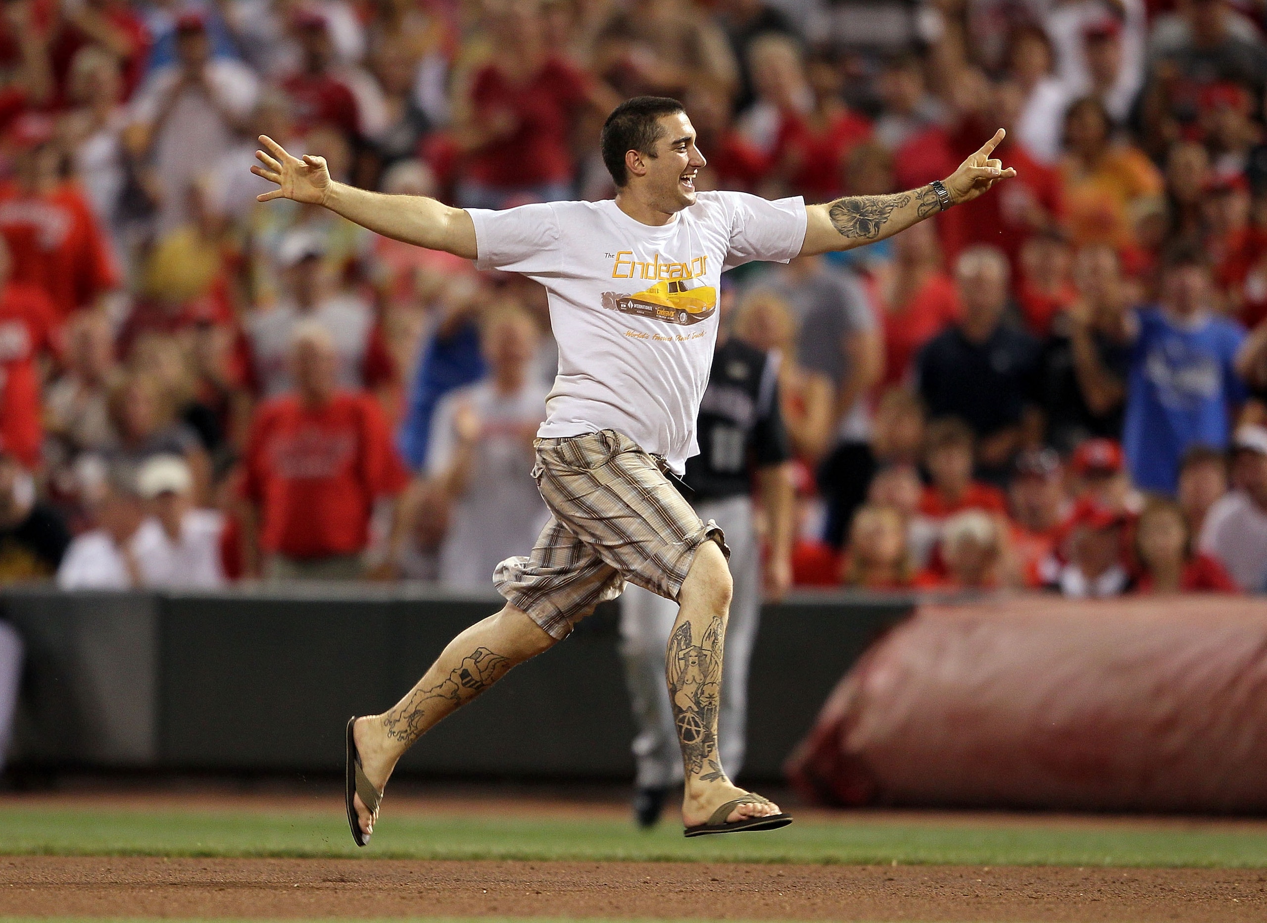 CINCINNATI - JULY 17: A fan runs on the field of the Colorado Rockies game against the Cincinnati Reds at Great American Ball Park on July 17, 2010 in Cincinnati, Ohio. (Photo by Andy Lyons/Getty Images) CINCINNATI - JULY 17: A fan runs on the field of the Colorado Rockies game against the Cincinnati Reds at Great American Ball Park on July 17, 2010 in Cincinnati, Ohio. (Photo by Andy Lyons/Getty Images)