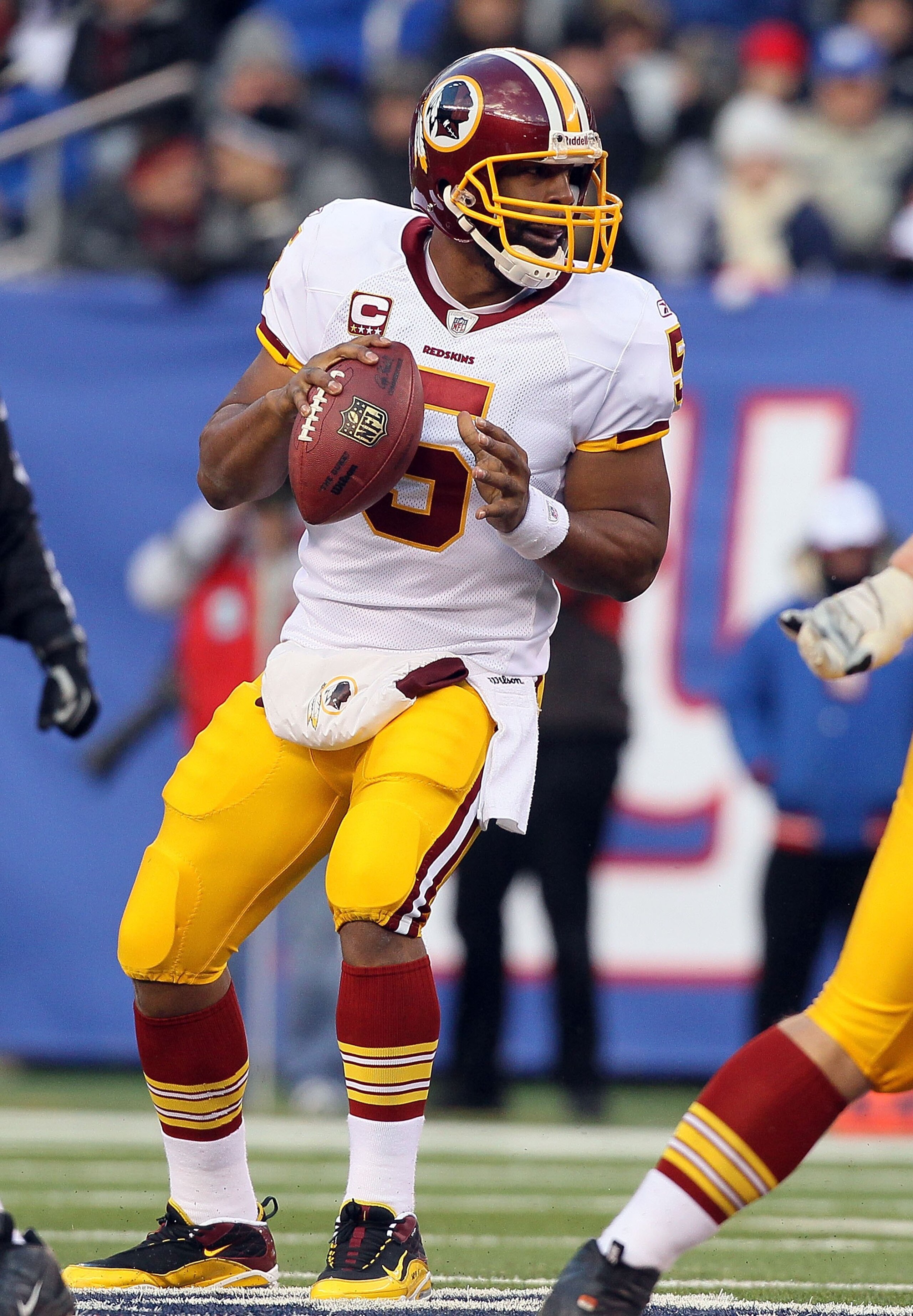 EAST RUTHERFORD, NJ - DECEMBER 05:  Donovan McNabb #5 of the Washington Redskins looks to throw a pass against the New York Giants on December 5, 2010 at the New Meadowlands Stadium in East Rutherford, New Jersey. The Giants defeated the Redskins 31-7.  (