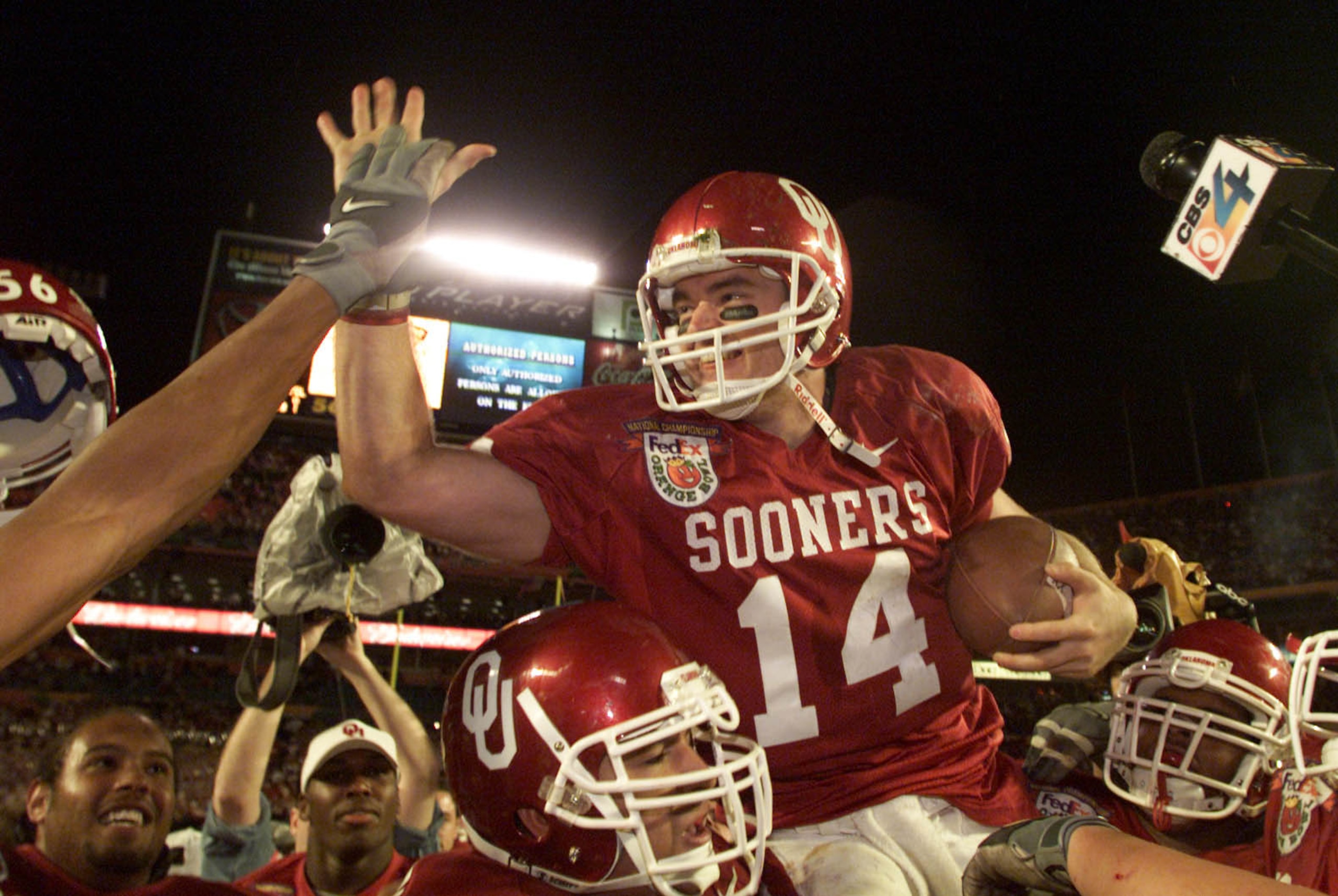 3 Jan 2001:  Quarterback Josh Heupel #14 of the Oklahoma Sooners is hoisted by his teammates after defeating the Florida State Seminoles 13-2 in the Orange Bowl at Pro Player Stadium in Miami, Florida. DIGITAL IMAGE Mandatory Credit: Andy Lyons/ALLSPORT