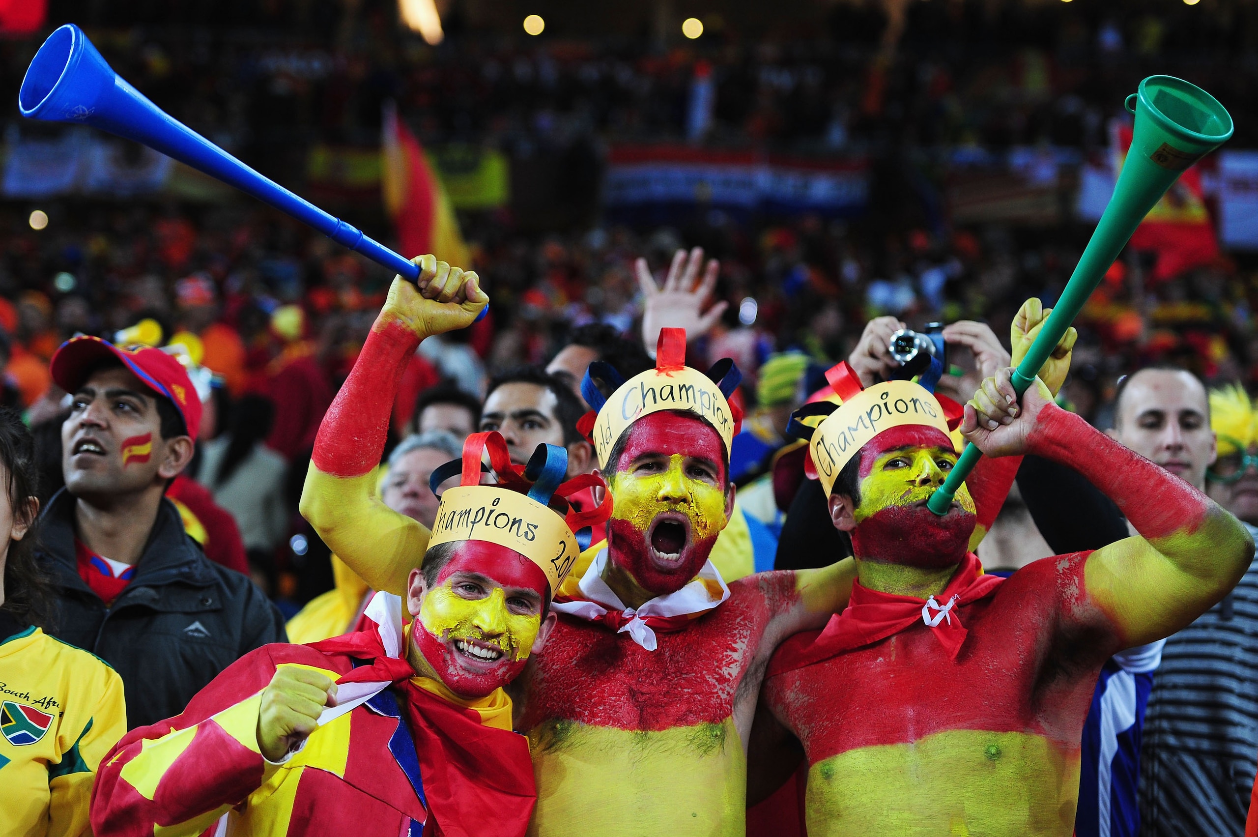 JOHANNESBURG, SOUTH AFRICA - JULY 11: Spain fans enjoy the atmosphere during the 2010 FIFA World Cup South Africa Final match between Netherlands and Spain at Soccer City Stadium on July 11, 2010 in Johannesburg, South Africa. (Photo by Clive Mason/Gett JOHANNESBURG, SOUTH AFRICA - JULY 11: Spain fans enjoy the atmosphere during the 2010 FIFA World Cup South Africa Final match between Netherlands and Spain at Soccer City Stadium on July 11, 2010 in Johannesburg, South Africa. (Photo by Clive Mason/Gett