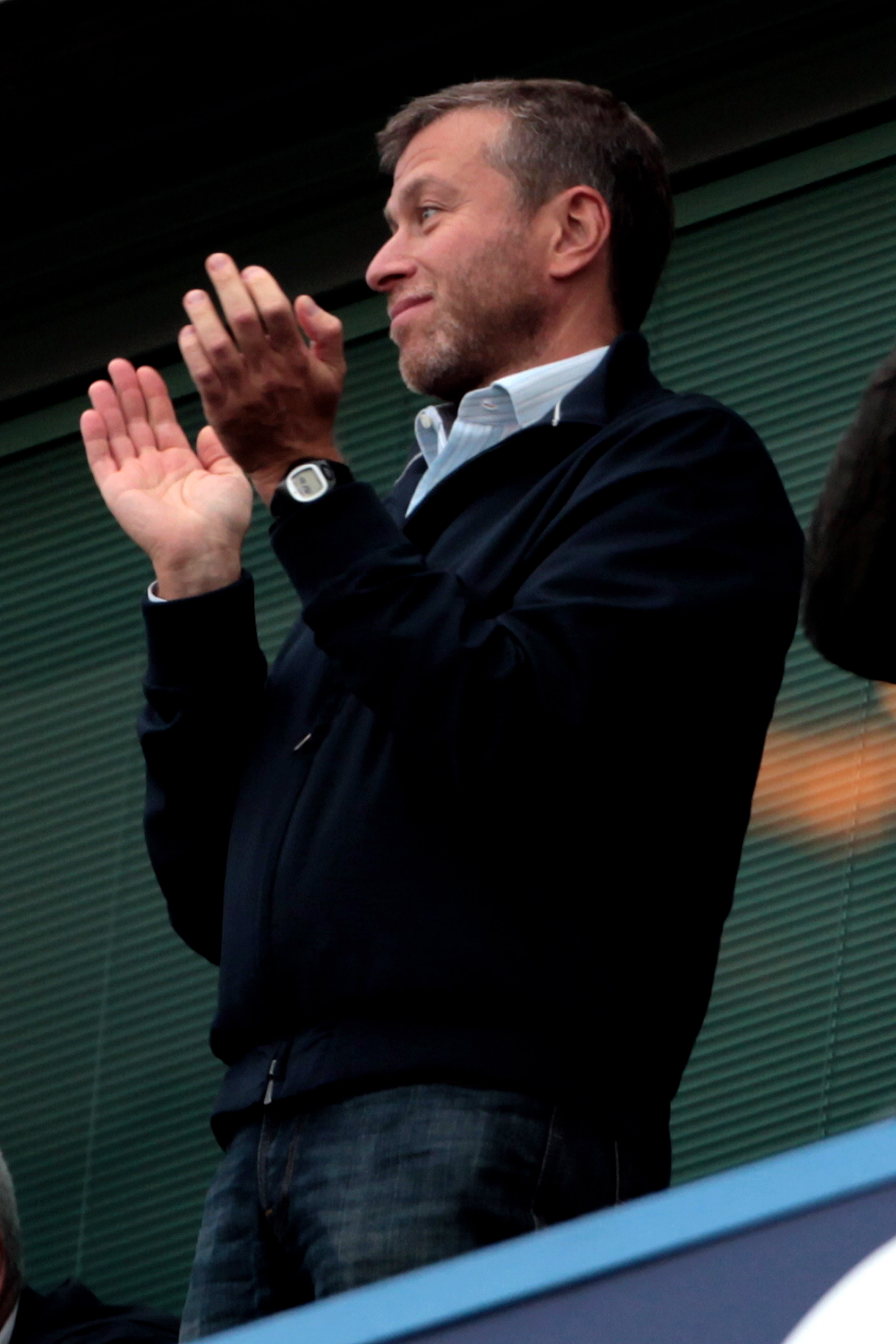 LONDON, ENGLAND - AUGUST 14:  Chelsea owner Roman Abramovich applauds his team on the final whistle following their 6-0 victory during the Barclays Premier League match between Chelsea and West Bromwich Albion at Stamford Bridge on August 14, 2010 in Lond