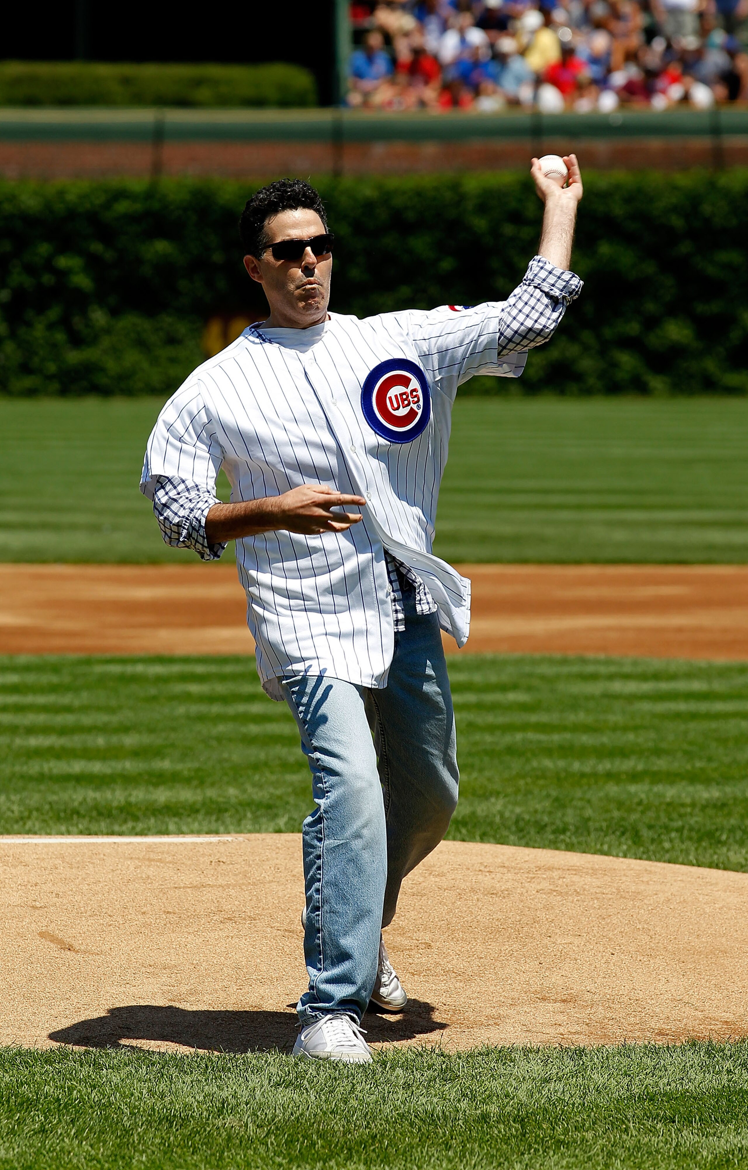 CHICAGO - JUNE 17: Comedian Adam Carolla throws out a ceremonial first pitch before a game between the Chicago Cubs and the Oakland Athletics at Wrigley Field on June 17, 2010 in Chicago, Illinois. The Cubs defeated the Athletics 3-2. (Photo by Jonathan D CHICAGO - JUNE 17: Comedian Adam Carolla throws out a ceremonial first pitch before a game between the Chicago Cubs and the Oakland Athletics at Wrigley Field on June 17, 2010 in Chicago, Illinois. The Cubs defeated the Athletics 3-2. (Photo by Jonathan D