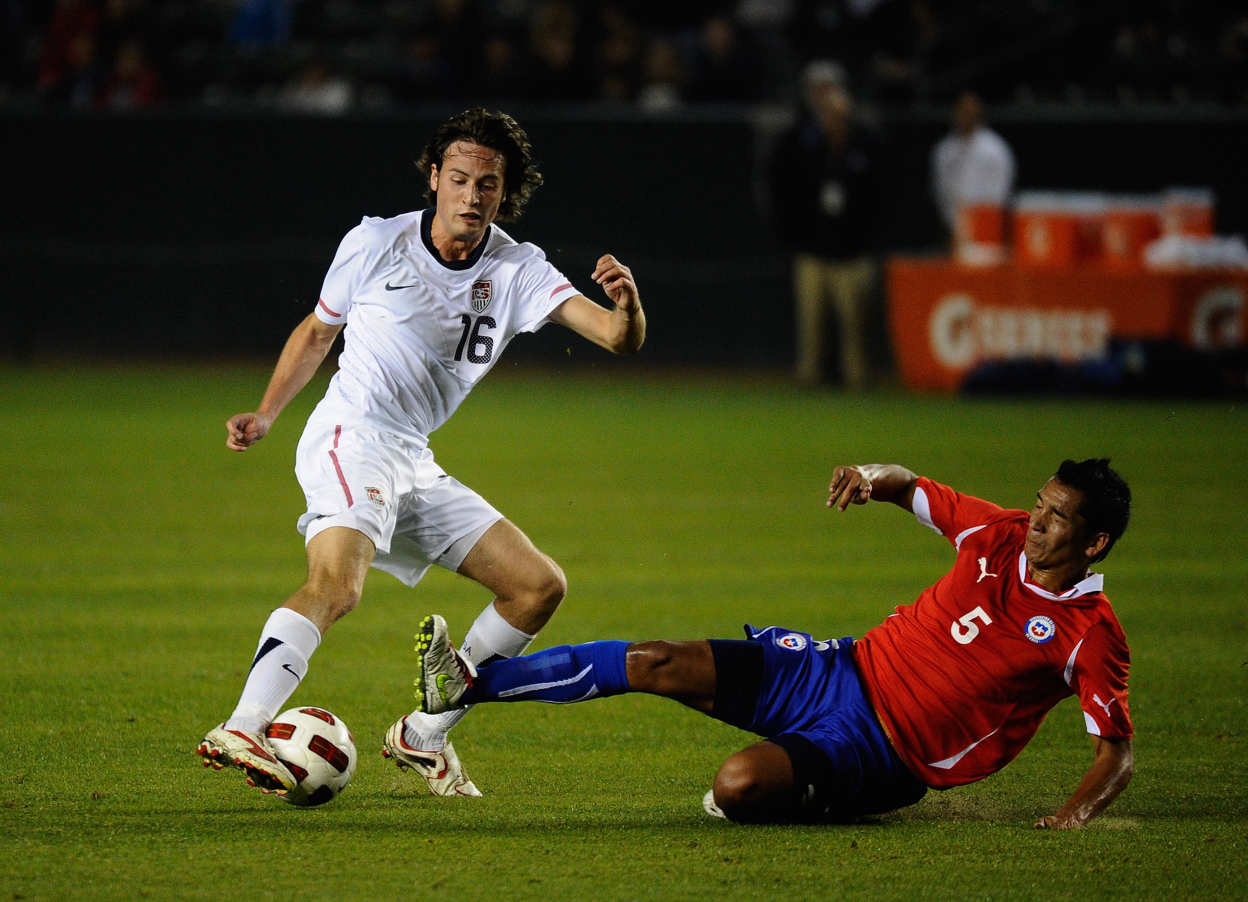 CARSON, CA - JANUARY 22: Sebastian Toro #5 of Chile tackles Mixx Diskerud #16 of the United States during the friendly soccer match at The Home Depot Center on January 22, 2011 in Carson, California. (Photo by Kevork Djansezian/Getty Images)