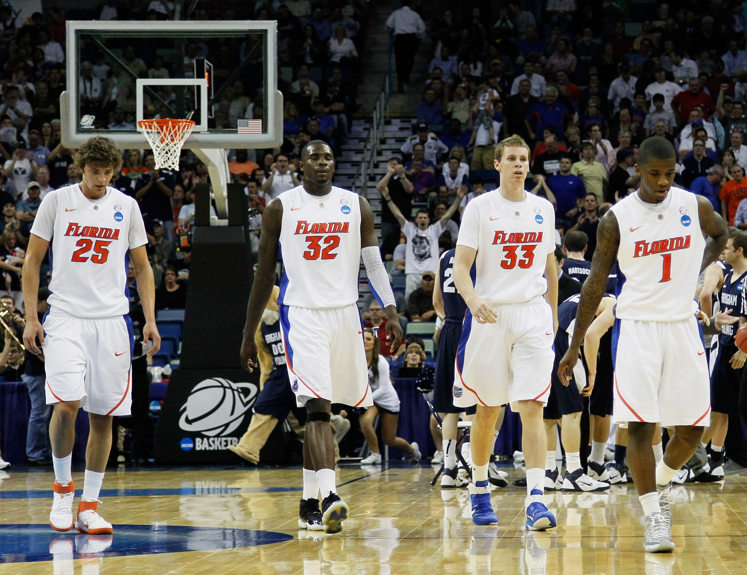 NEW ORLEANS, LA - MARCH 24:  Chandler Parsons #25, Vernon Macklin #32, Erik Murphy #33 and Kenny Boynton #1 of the Florida Gators walk off on the court during their game against the Brigham Young Cougars in the Southeast regional of the 2011 NCAA men's ba