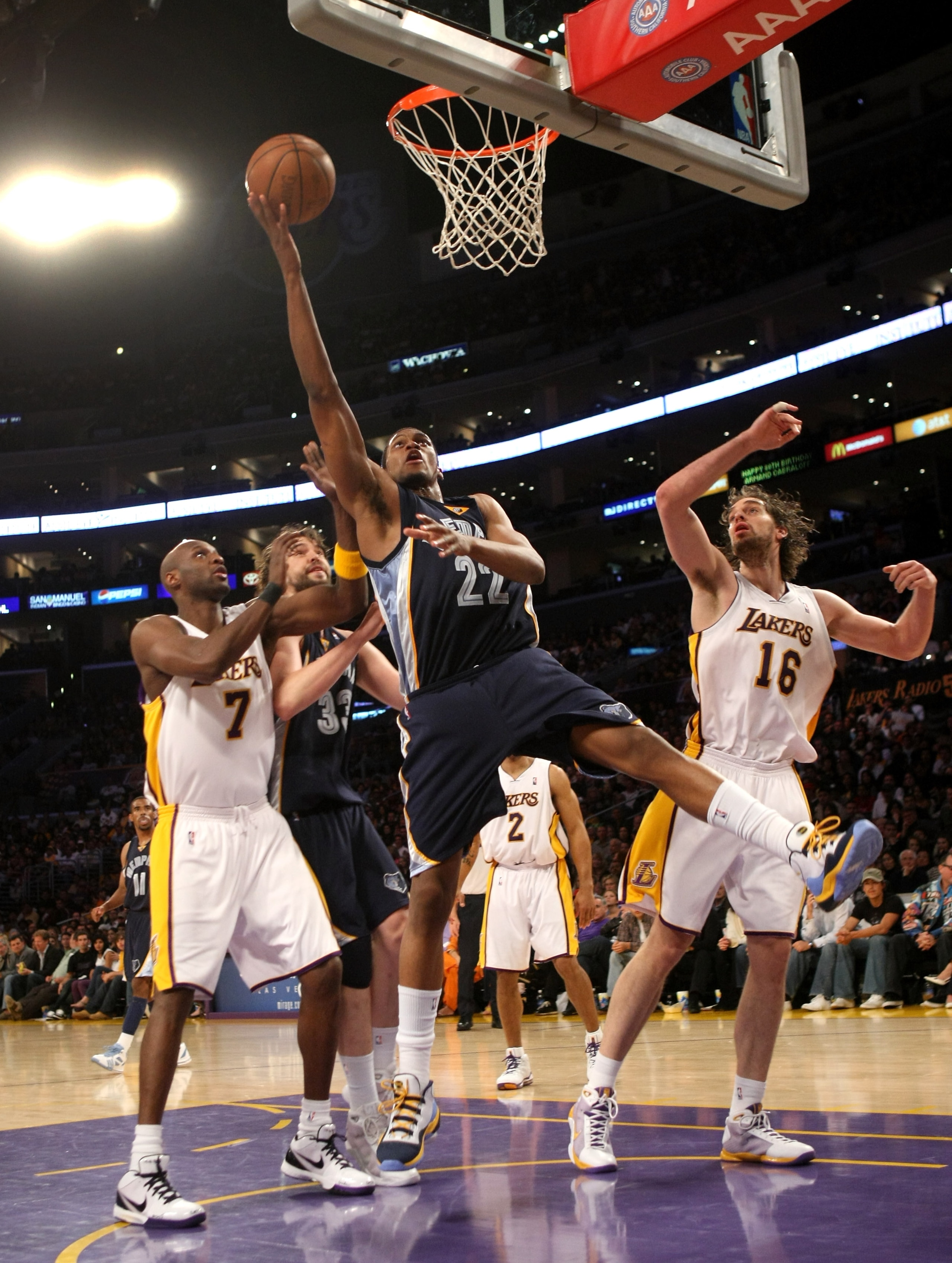 LOS ANGELES - APRIL 12: Rudy Gay #22 of the Memphis Grizzlies shoots over Pau Gasol #16 and Lamar Odom #7 of the Los Angeles Lakers on April 12, 2009 at Staples Center in Los Angeles, California. The Lakers won 92-75. NOTE TO USER: User expressly acknowle