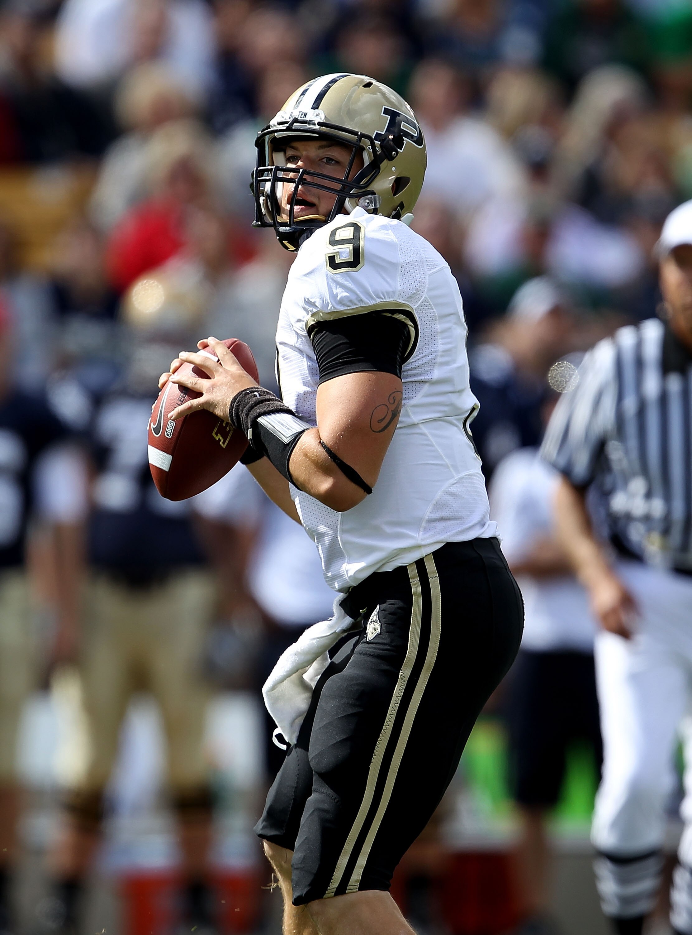 SOUTH BEND, IN - SEPTEMBER 04: Robert Marve #9 of the Purdue Boilermakers looks for a receiver against the Notre Dame Fighting Irish at Notre Dame Stadium on September 4, 2010 in South Bend, Indiana. Notre Dame defated Purdue 23-12. (Photo by Jonathan Dan