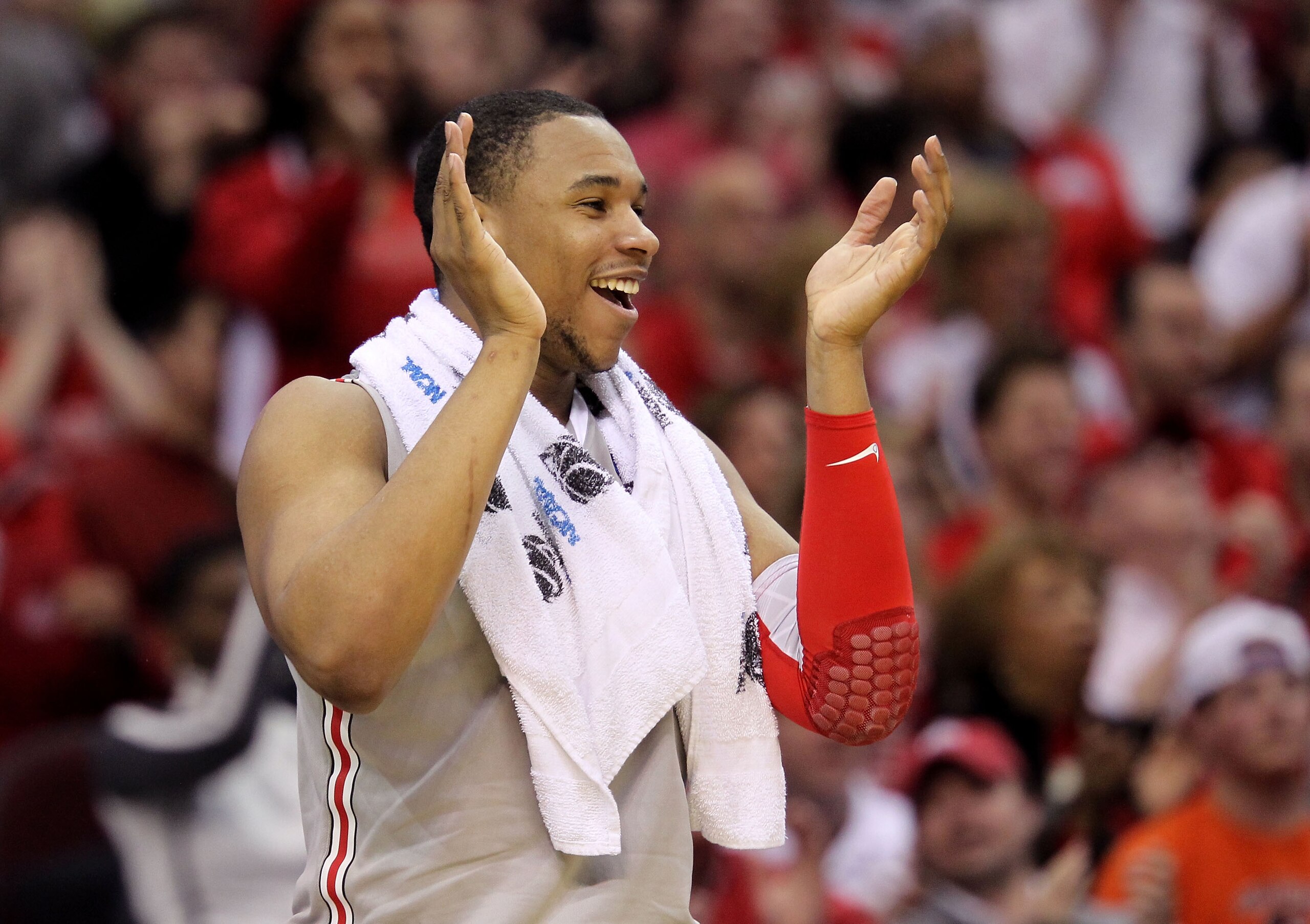 CLEVELAND, OH - MARCH 20: Jared Sullinger #0 of the Ohio State Buckeyes claps from the bench late in the game against the George Mason Patriots during the third of the 2011 NCAA men's basketball tournament at Quicken Loans Arena on March 20, 2011 in Cleve