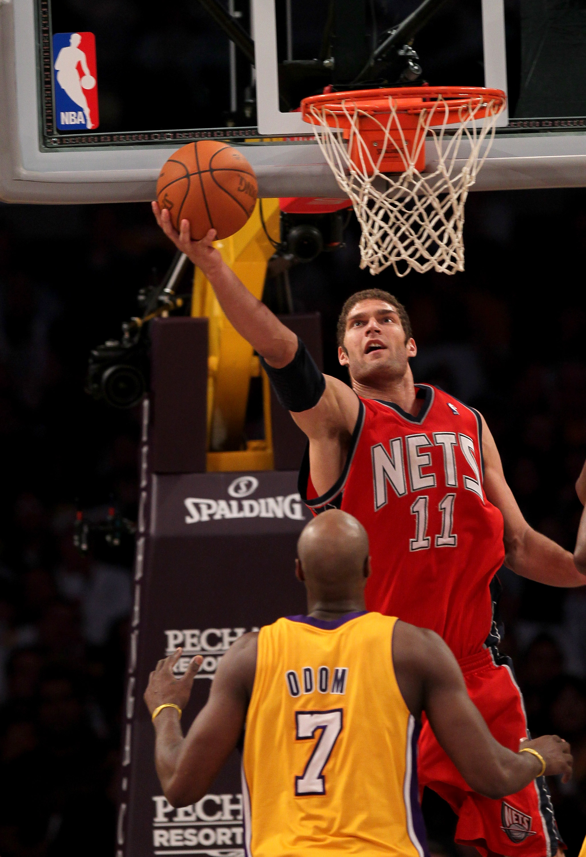 LOS ANGELES, CA - JANUARY 14:  Brook Lopez #11 of the New Jersey Nets shoots over Lamar Odom #7 of the Los Angeles Lakers at Staples Center on January 14, 2011 in Los Angeles, California. The Lakers won 100-88.  NOTE TO USER: User expressly acknowledges a