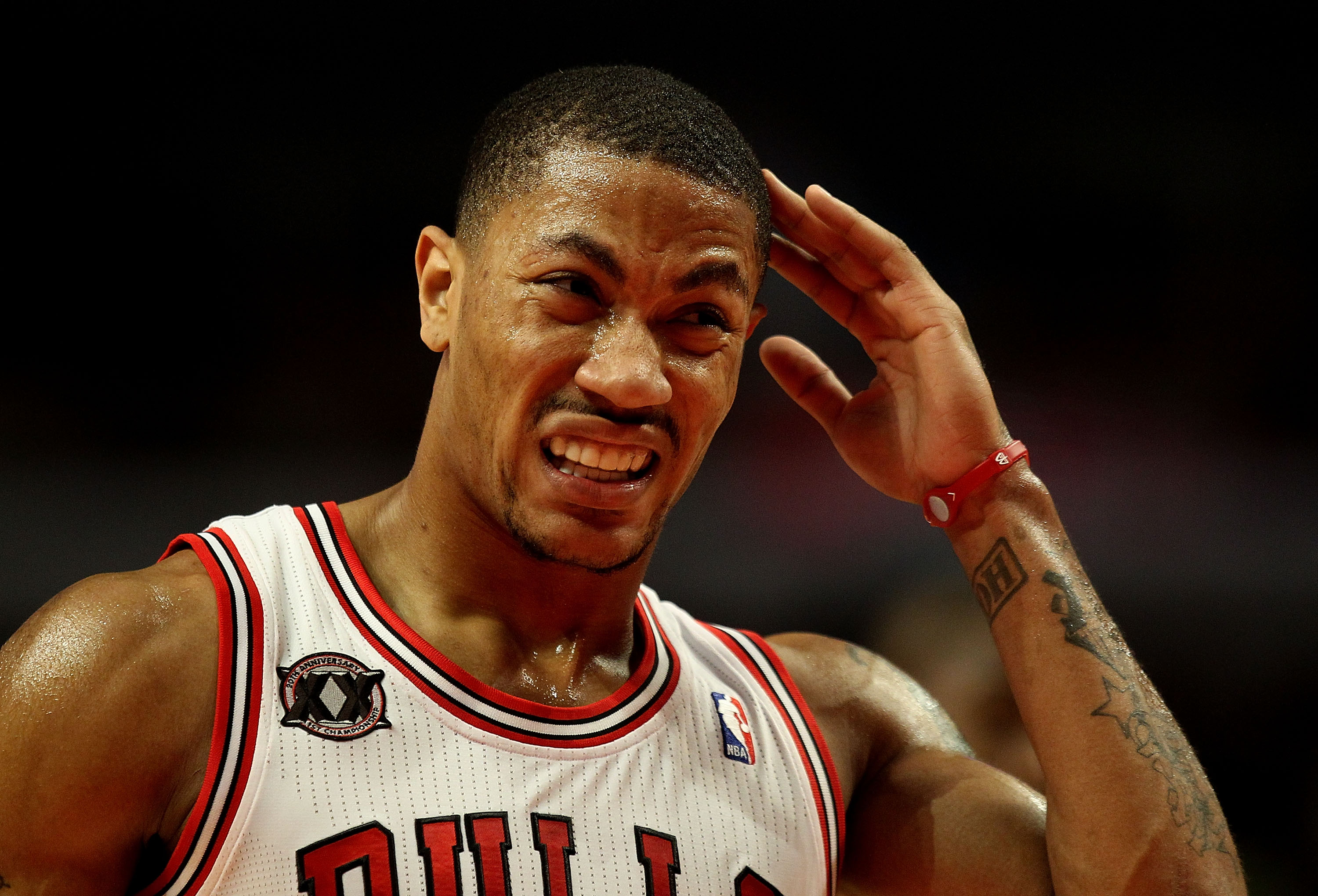 CHICAGO, IL - MARCH 25: Derrick Rose #1 of the Chicago Bulls rubs his head after being fouled and hitting it on the floor against the Memphis Grizzlies at the United Center on March 25, 2011 in Chicago, Illinois. The Bulls defeated the Grizzlies 99-96. NO