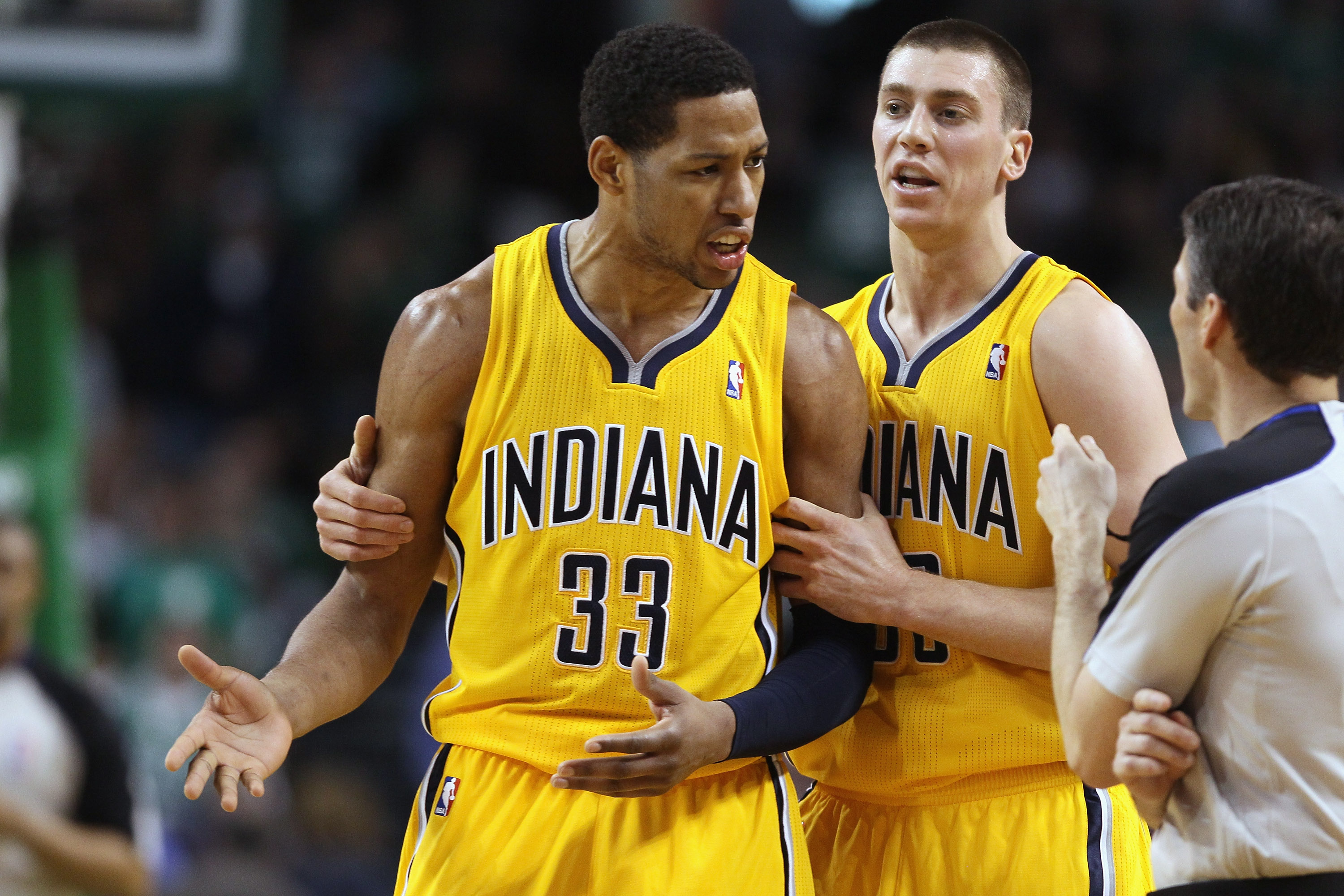 BOSTON, MA - MARCH 16: Danny Granger #33 is pulled away from the referee by teamamte Tyler Hansbrough #50 of the Indiana Pacers on March 16, 2011 at the TD Garden in Boston, Massachusetts. Granger was called for a techical foul. The Celtics defeated the