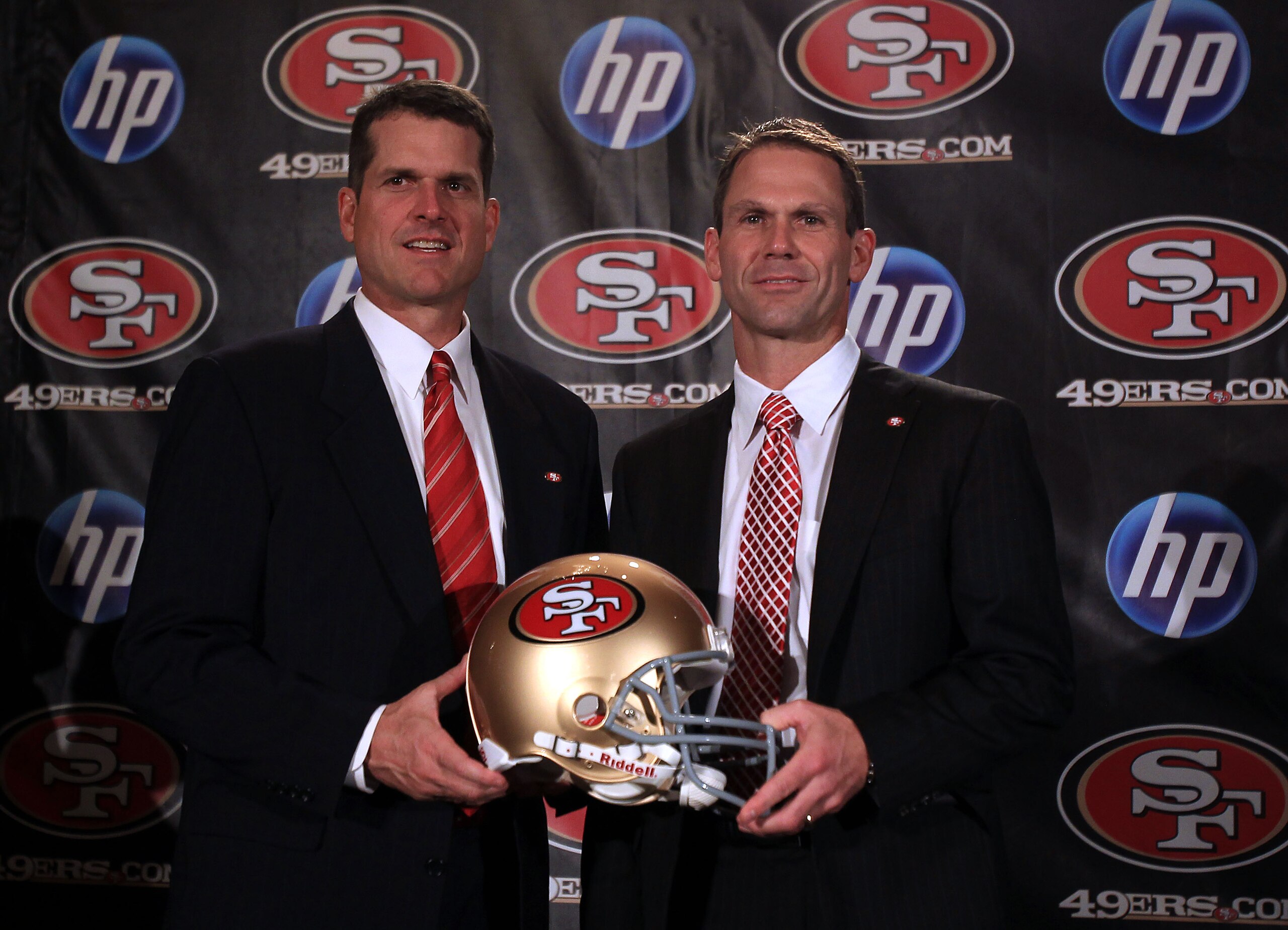 SAN FRANCISCO, CA - JANUARY 07:  Jim Harbaugh and general manager Trent Baalke pose for a picture following a press conference where Harbaugh was introduced as the new San Francisco 49ers head coach at the Palace Hotel on January 7, 2011 in San Francisco,