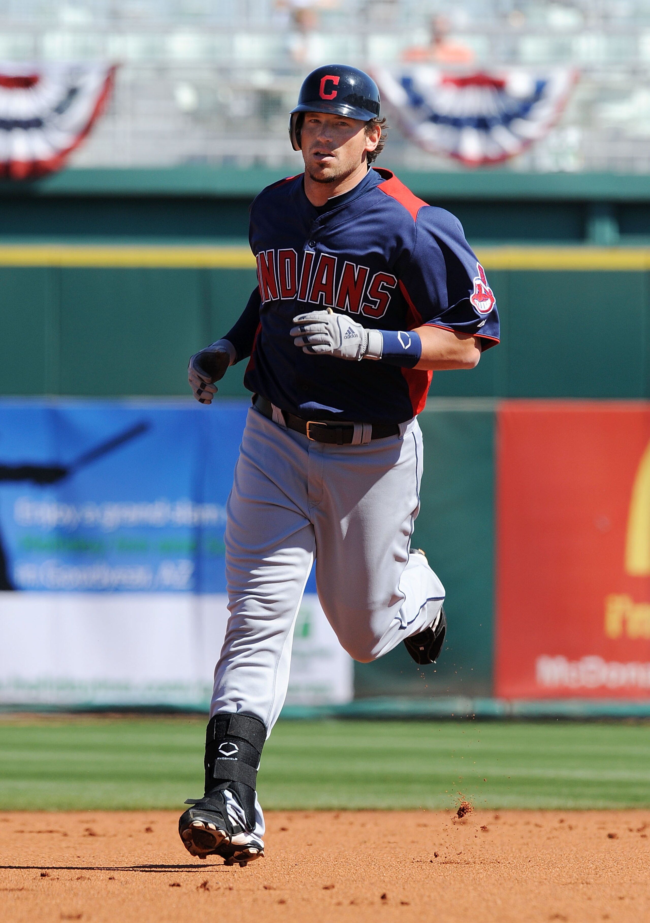 GOODYEAR, AZ - FEBRUARY 28:  Travis Buck #28 of the Cleveland Indians rounds second base after hitting a home run against the Cincinnati Reds at Goodyear Ballpark on February 28, 2011 in Goodyear, Arizona.  (Photo by Norm Hall/Getty Images)