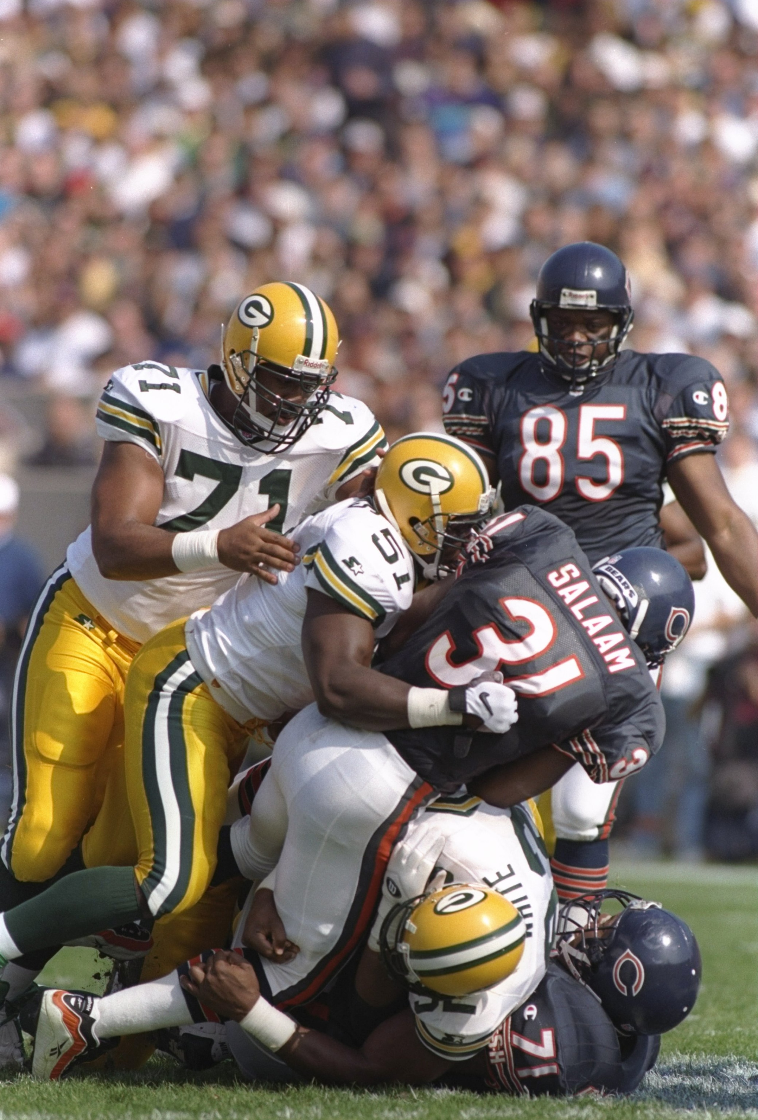 13 Oct 1996: Linebacker Brian Williams #51 of the Green Bay Packers makes contact with running back Rashaan Salaam #31 of the Chicago Bears at the line of scrimmage during a carry in the Packers 37-6 victory over the Bears at Soldier Field in Chicago, Ill