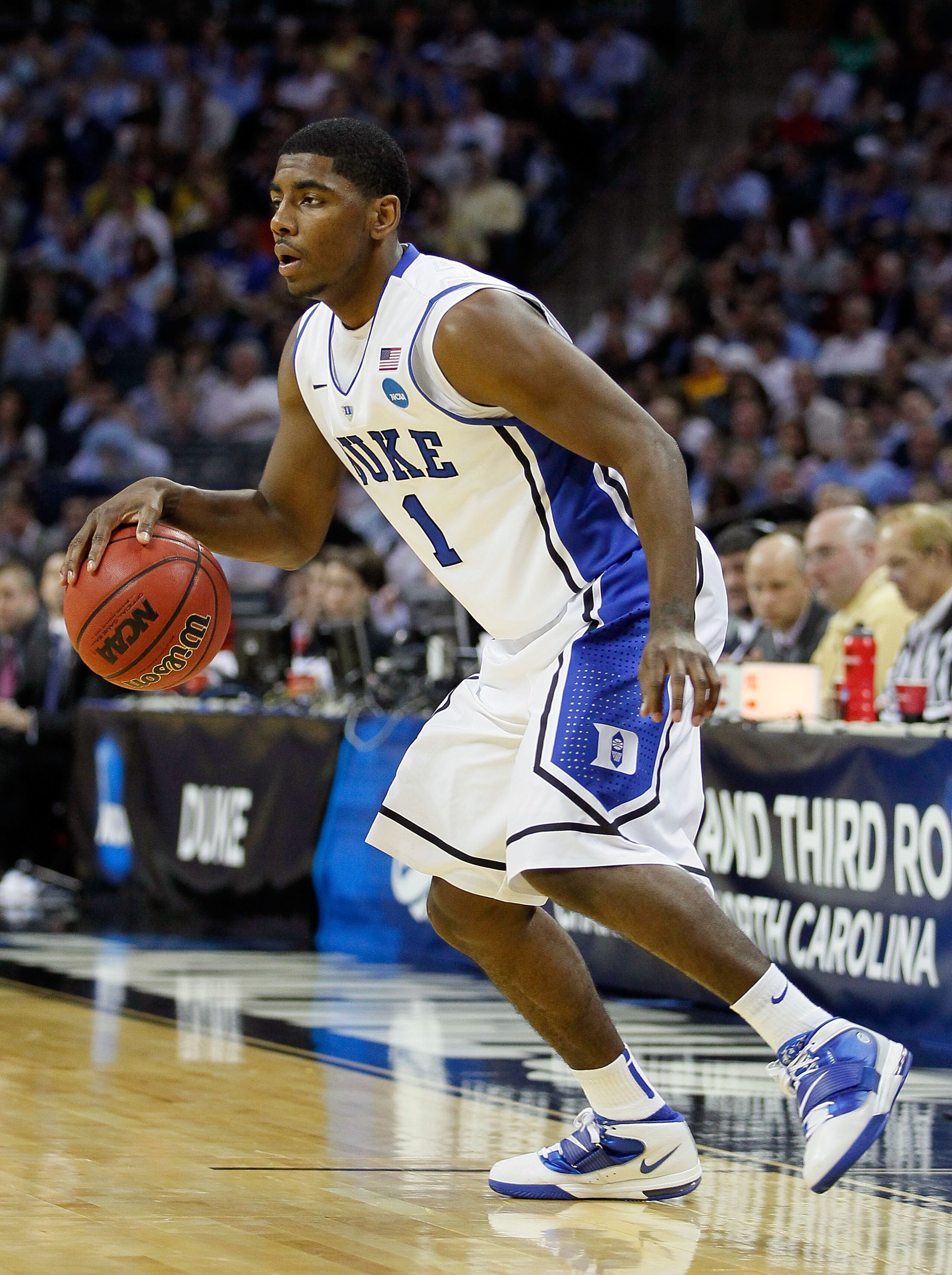 CHARLOTTE, NC - MARCH 20: Kyrie Irving #1 of the Duke Blue Devils moves the ball while taking on the Michigan Wolverines during the third round of the 2011 NCAA men's basketball tournament at Time Warner Cable Arena on March 20, 2011 in Charlotte, North CHARLOTTE, NC - MARCH 20: Kyrie Irving #1 of the Duke Blue Devils moves the ball while taking on the Michigan Wolverines during the third round of the 2011 NCAA men's basketball tournament at Time Warner Cable Arena on March 20, 2011 in Charlotte, North