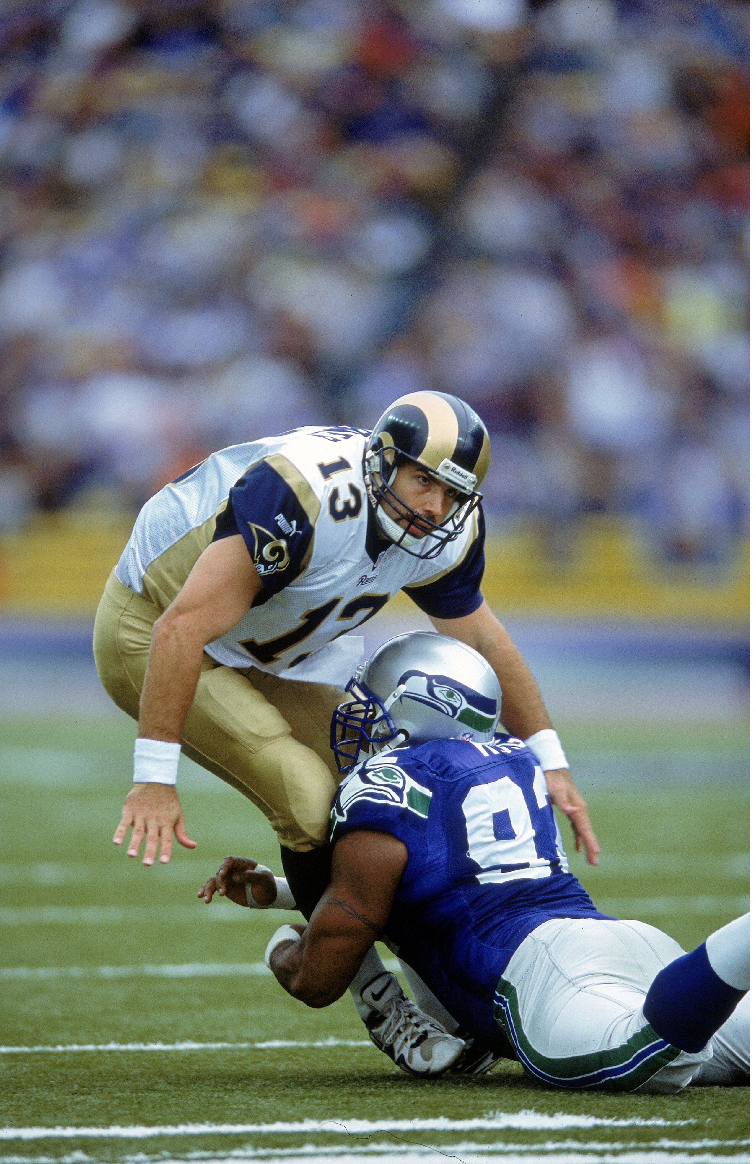 10 Sep 2000: Kurt Warner #13 of the St. Louis Rams is sacked by Lamar King #92 of the Seattle Seahawks at the Husky Stadium in Seattle, Washington. The Rams defeated the Seahawks 37-34.Mandatory Credit: Otto Greule Jr.  /Allsport