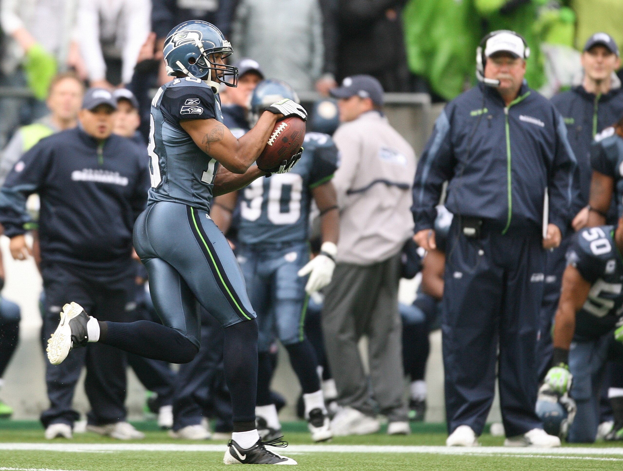 SEATTLE - NOVEMBER 02:  Wide receiver Koren Robinson #18 of the Seattle Seahawks scores on a 90 yard touchdown on the first play of the game against the Philadelphia Eagles on November 2, 2008 at Qwest Field in Seattle, Washington. (Photo by Otto Greule J