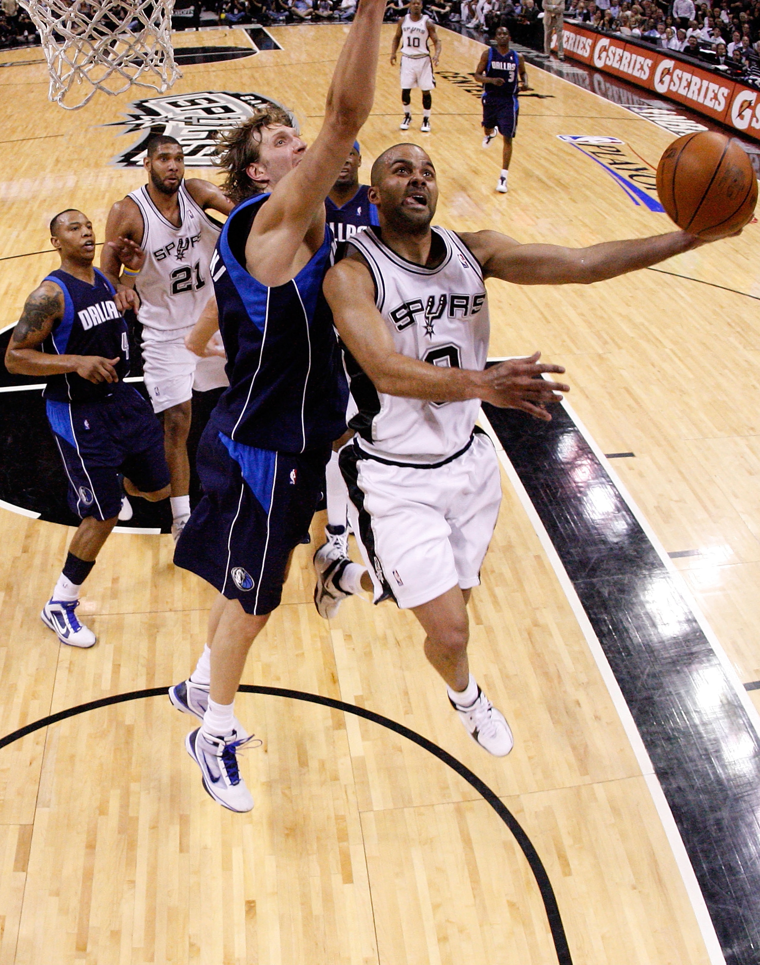 SAN ANTONIO - APRIL 29:  Guard Tony Parker #9 of the San Antonio Spurs takes a shot against Dirk Nowitzki #41 of the Dallas Mavericks in Game Six of the Western Conference Quarterfinals during the 2010 NBA Playoffs at AT&T Center on April 29, 2010 in San
