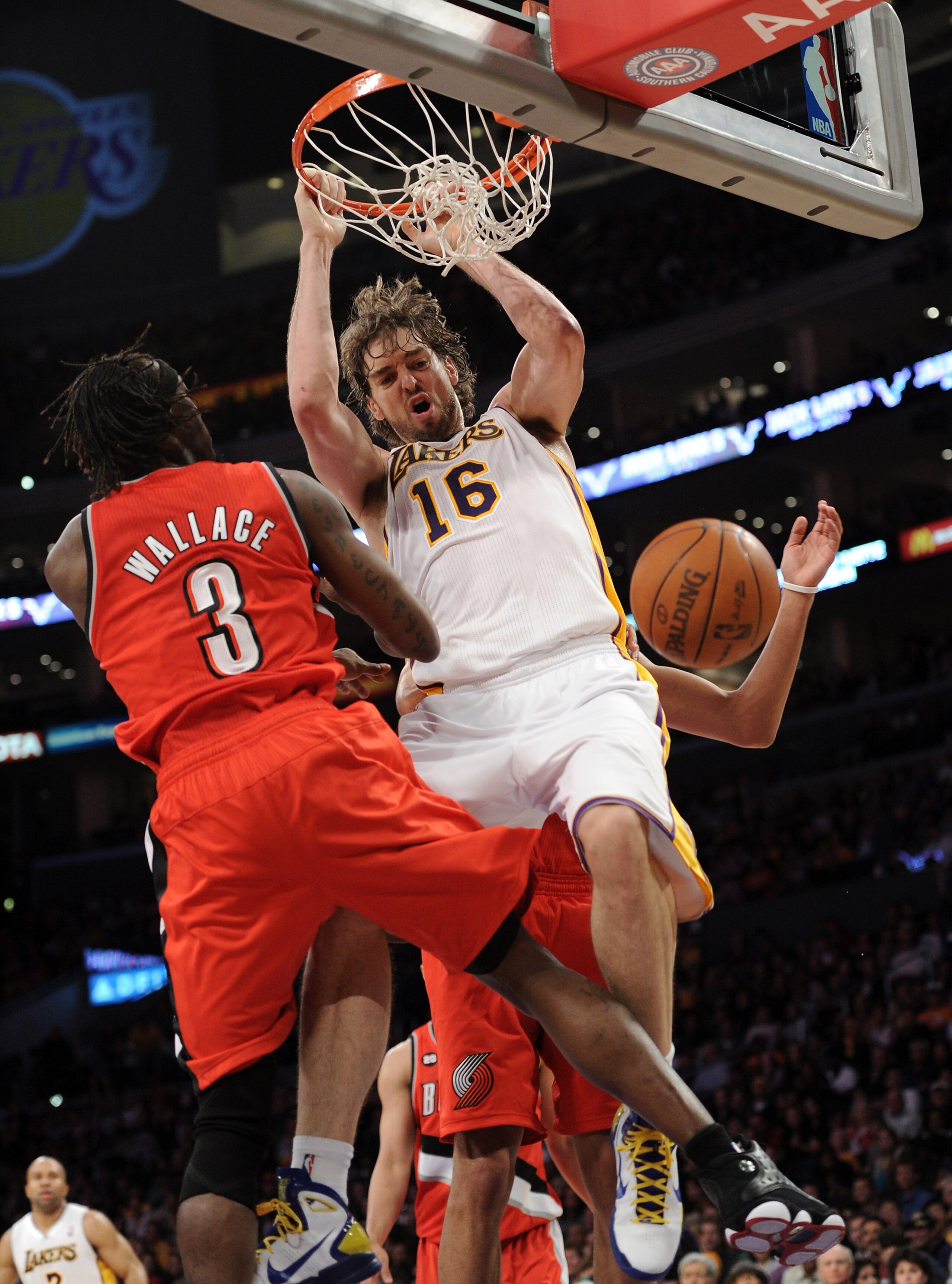 LOS ANGELES, CA - MARCH 20:  Pau Gasol #16 of the Los Angeles Lakers dunks the ball in front of Gerald Wallace #3 of the Portland Trail Blazers at the Staples Center on March 20, 2011 in Los Angeles, California.  NOTE TO USER: User expressly acknowledges